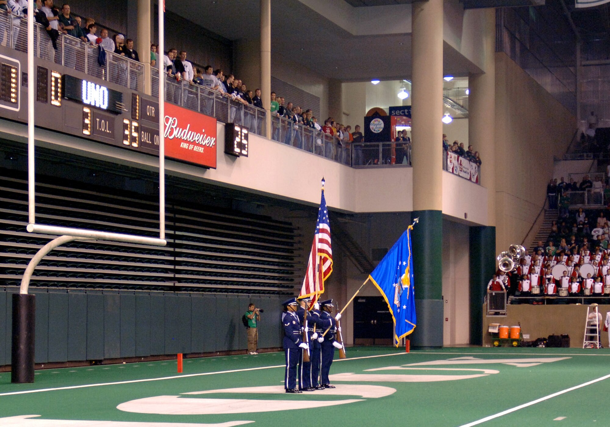 Honor Guard members from the 319th Air Refueling Wing perform color guard during the opening ceremonies at Military Appreciation Day football game between the University of North Dakota Fighting Sioux and the University of Nebraska at Omaha Mavericks in Grand Forks Oct.13. The city of Grand Forks provides many opportunities for the Air Force community to get involved in local events, one being the yearly Military Appreciation Day event. (U.S. Air Force photo/Senior Airman SerMae Lampkin)