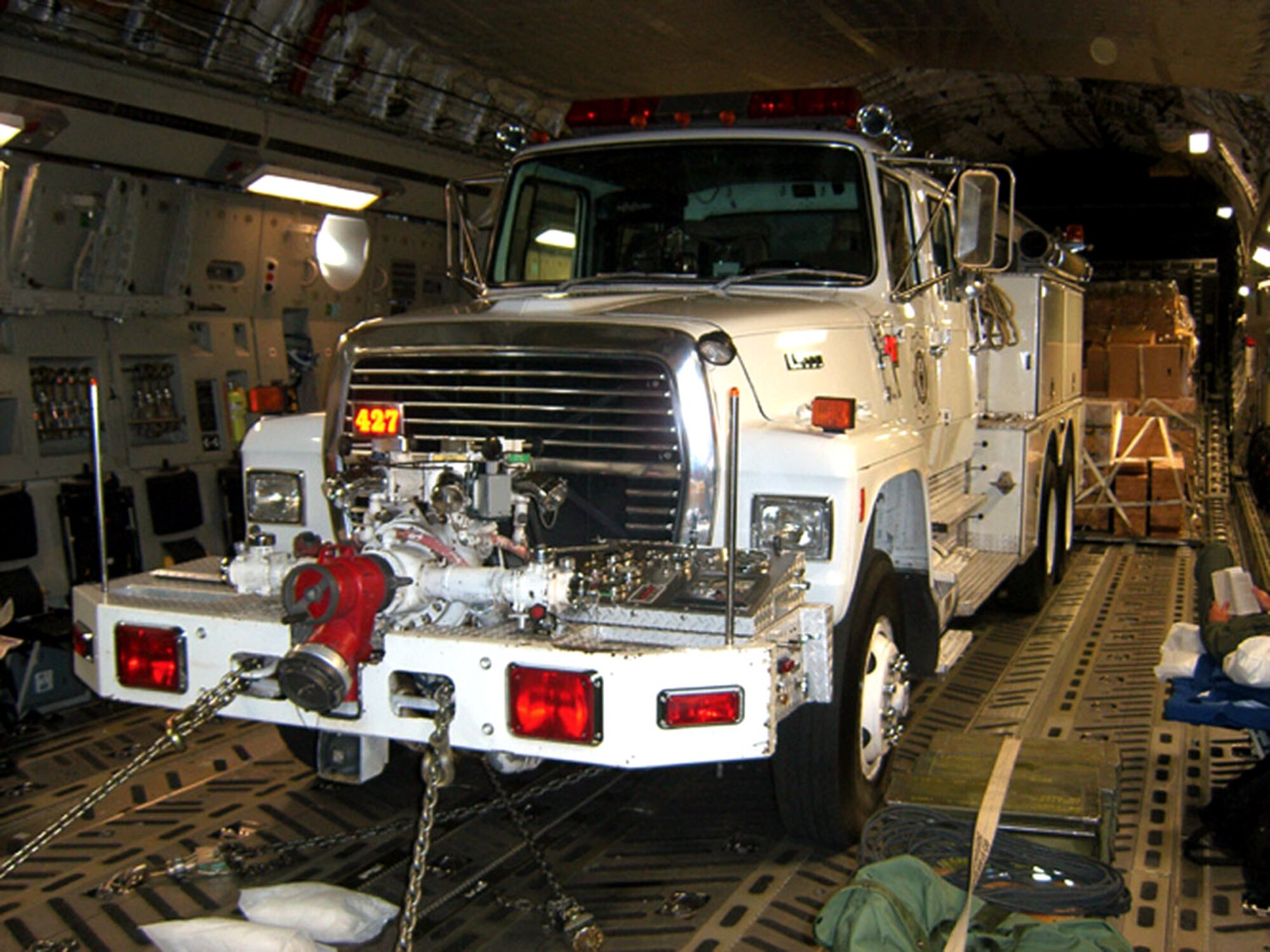 A donated fire truck picked up in Klamath Falls, Ore., is loaded onto a C-17 Globemaster III and on its way to Nicaragua Oct. 14 by Airmen from McChord Air Force Base, Wash. The Air Force Reserve aircrew from the 446th Airlift Wing at McChord AFB flew the fire truck and 100 pediatric wheelchairs picked up in Sioux Falls, Iowa, on a Denton Program mission. (U.S. Air Force photo/Maj. Jon Karnes)