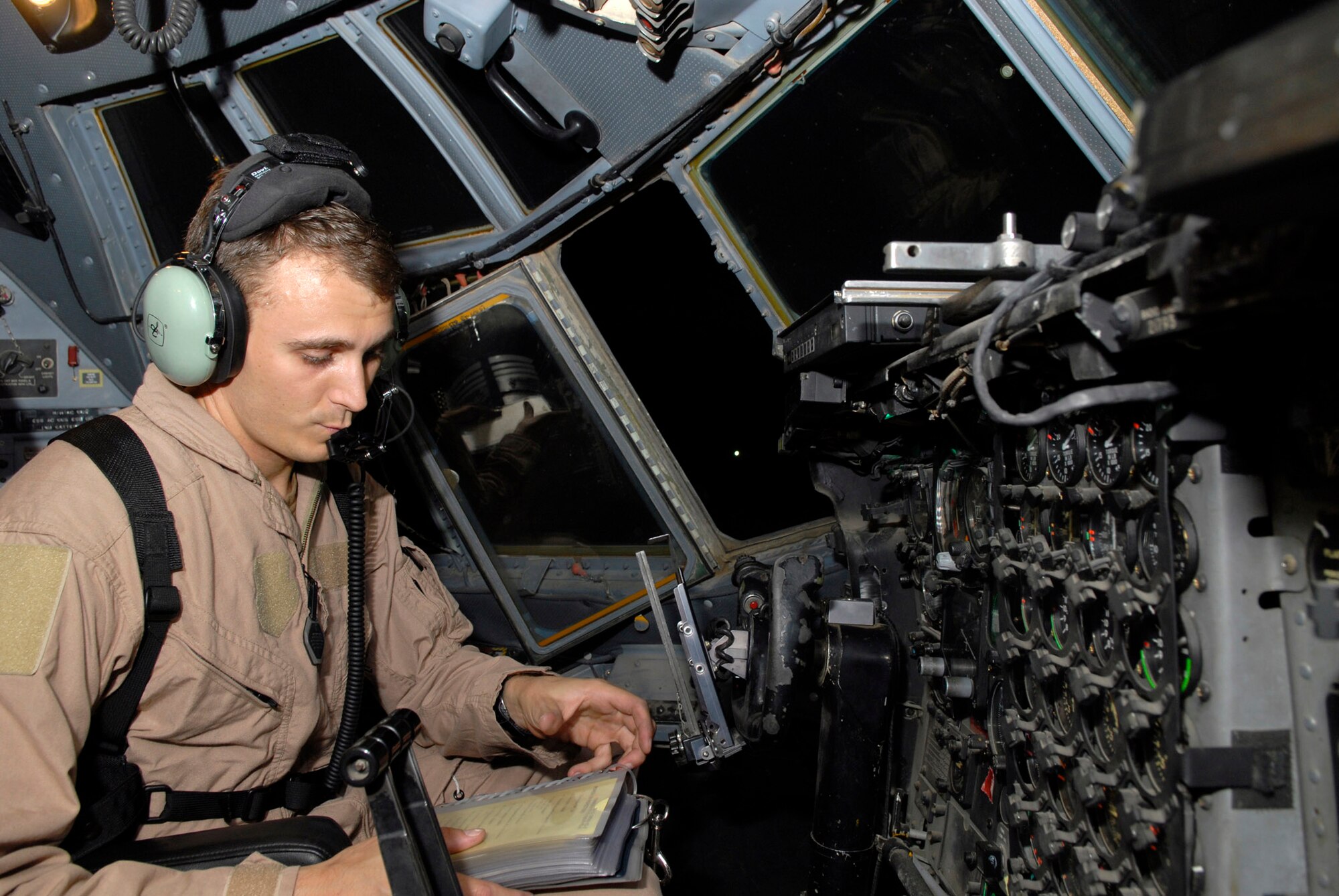 Tech. Sgt. James Brady runs through a startup checklist on a C-130 Hercules at Balad Air Base, Iraq, Oct. 17. It is up to Sergeant Brady, as the flight engineer, to ensure everything on the aircraft is properly functioning and configured. He is assigned to the 777th Expeditionary Airlift Squadron and is deployed from Little Rock Air Force Base, Ark. (U.S. Air Force photo/Staff Sgt. Joshua Garcia)
