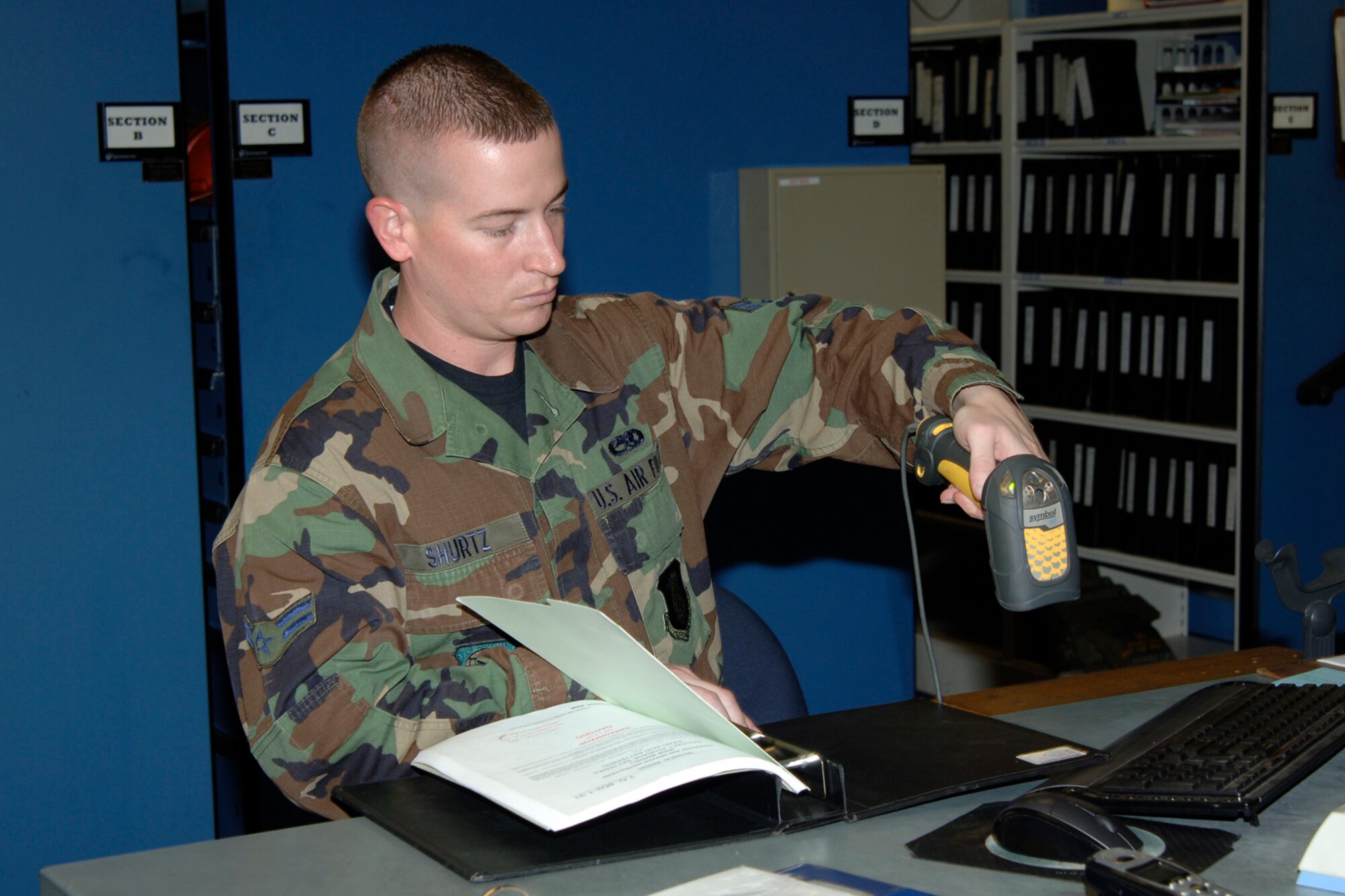 MCCONNELL AIR FORCE BASE, Kan. -- Airman 1st Class Allan Shurtz, 22 Maintenance Squadron, checks out a technical order through the tool accountability system, Oct. 17 in the support area of the AGE shop.  This database assists personnel in tracking equipment, inspections, tools, etc.  (Photo by Airman 1st Class Roy Lynch III)
