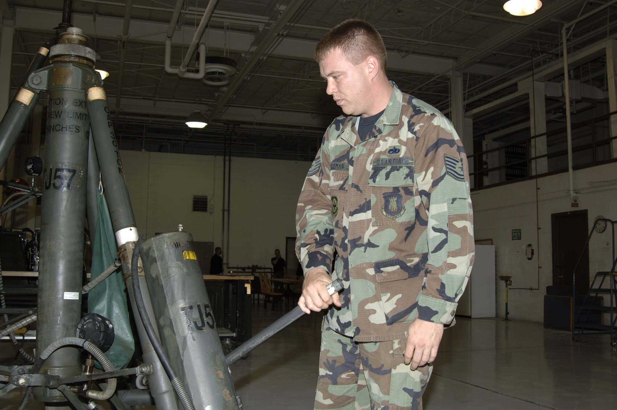 MCCONNELL AIR FORCE BASE, Kan. – Tech. Sgt. James Frieman, 22 Maintenance Squadron performs a 7 level inspection on the 30 ton aircraft tripod jack Oct. 17.  7 level inspections are performed on all equipment that receives maintenance, to help ensure quality assurance of the item.  (Photo by Airman 1st Class Roy Lynch III)
