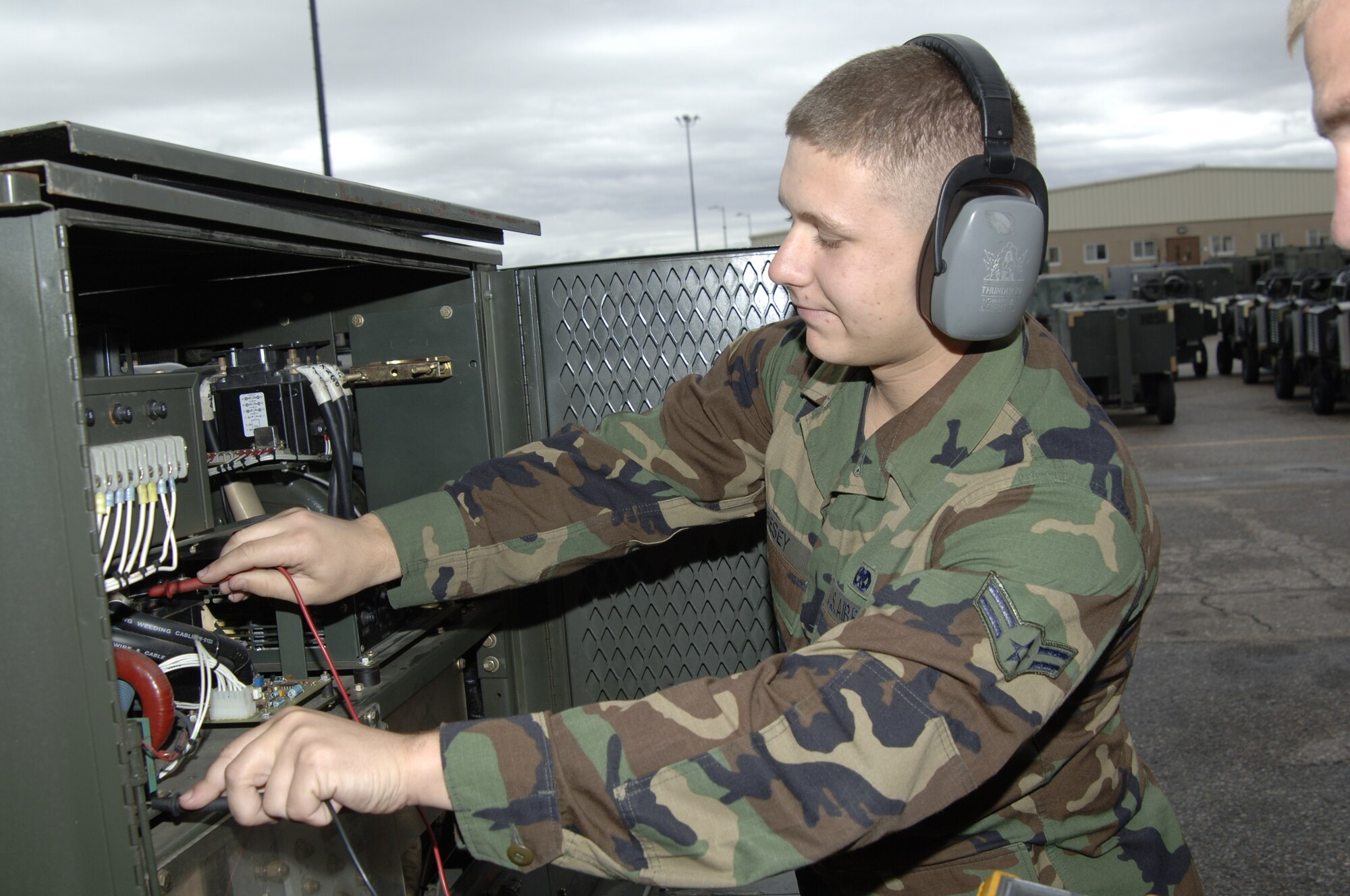 MCCONNELL AIR FORCE BASE, Kan. -- Airman 1st Class Justin Geesey, 22 Maintenance Squadron checks the electrical current running through a section on a Hobart -86 Generator Oct. 17.  Preventative maintenance inspections help ensure operational serviceability of equipment.   (Photo by Airman 1st Class Roy Lynch III)