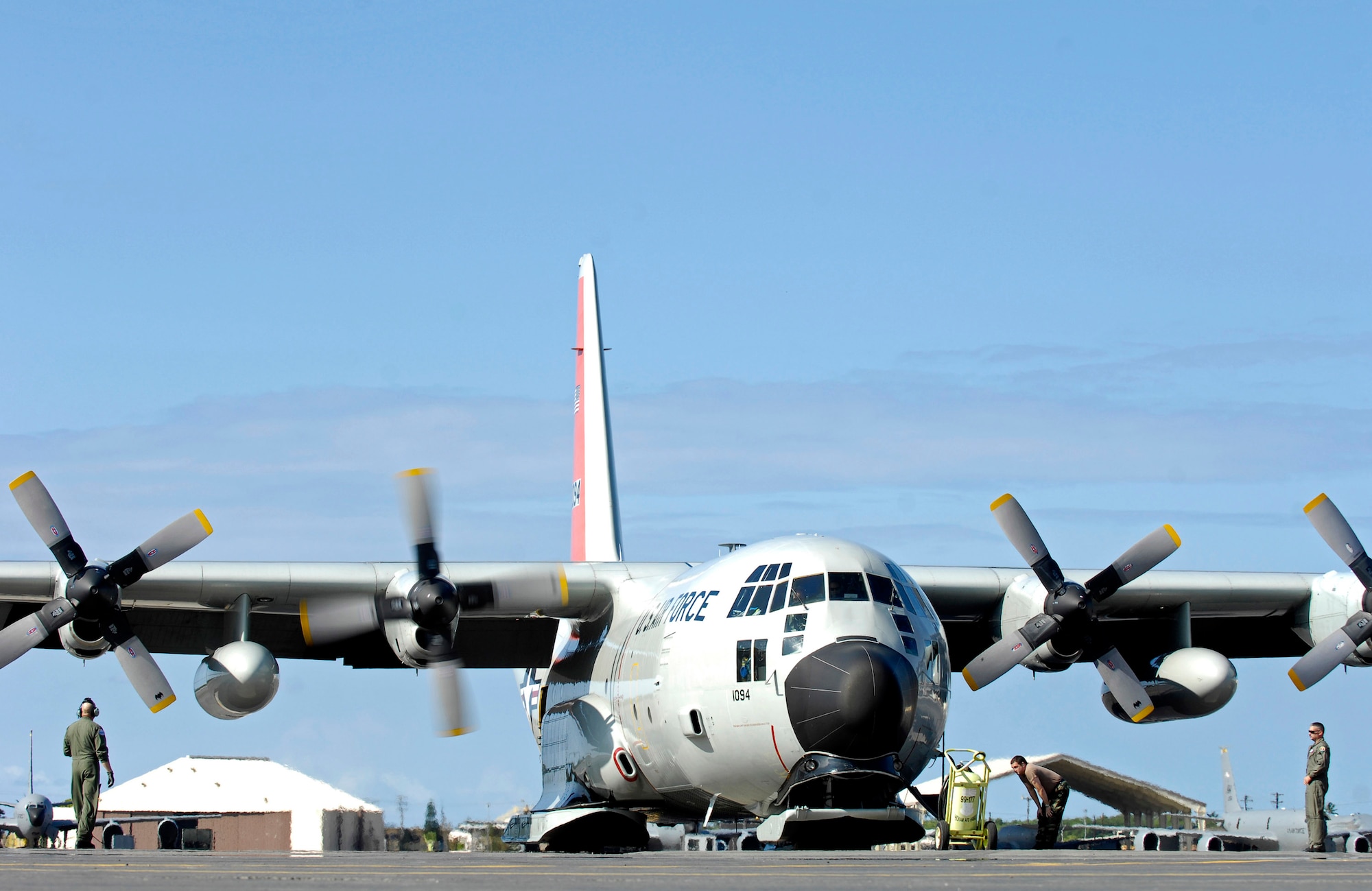 0A loadmaster and maintainers conduct engine start-up checks before departing from Oct. 17 from Hickam Air Force Base, Hawaii. Ski-equipped LC-130 Hercules aircraft, crews and support personnel from the New York Air National Guard's 109th Airlift Wing are transiting Hickam and will begin deploying to McMurdo Station, Antarctica, to support the 13 th Air Force-led Joint Task Force Support Forces Antarctica, Operation Deep Freeze. (U.S. Air Force photo/Tech. Sgt. Shane A. Cuomo) 