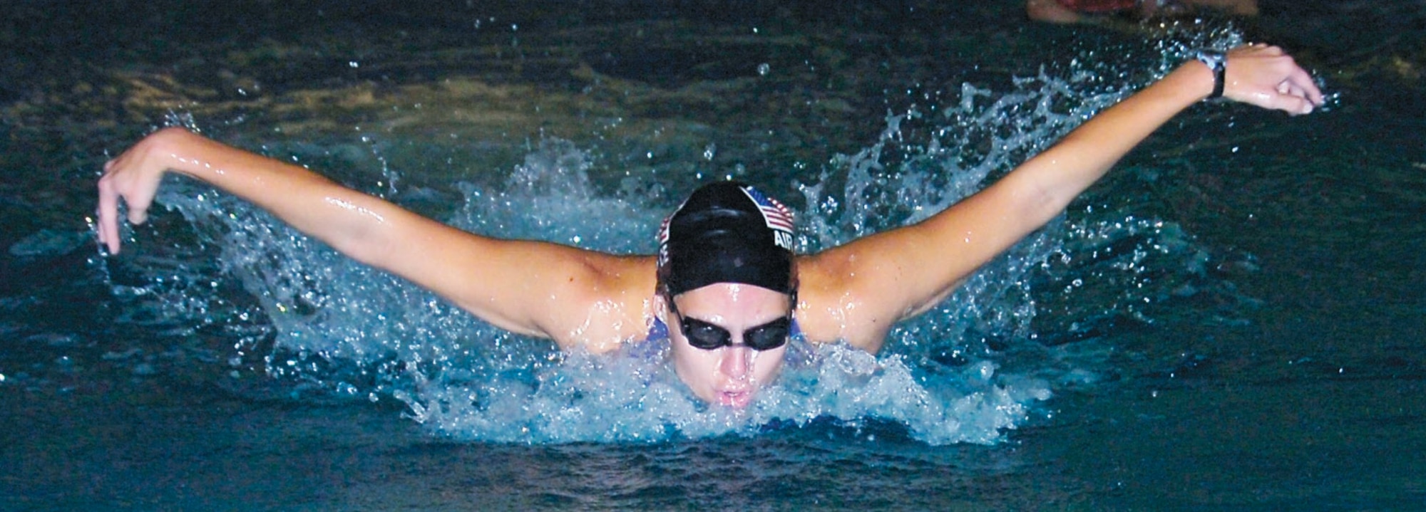 1st Lt. Sarah Brehm practices her breast stroke during an early morning training session at the Mount Vernon Recreation Center in Alexandria, Va., Oct. 8. (US Air Force/Bobby Jones)