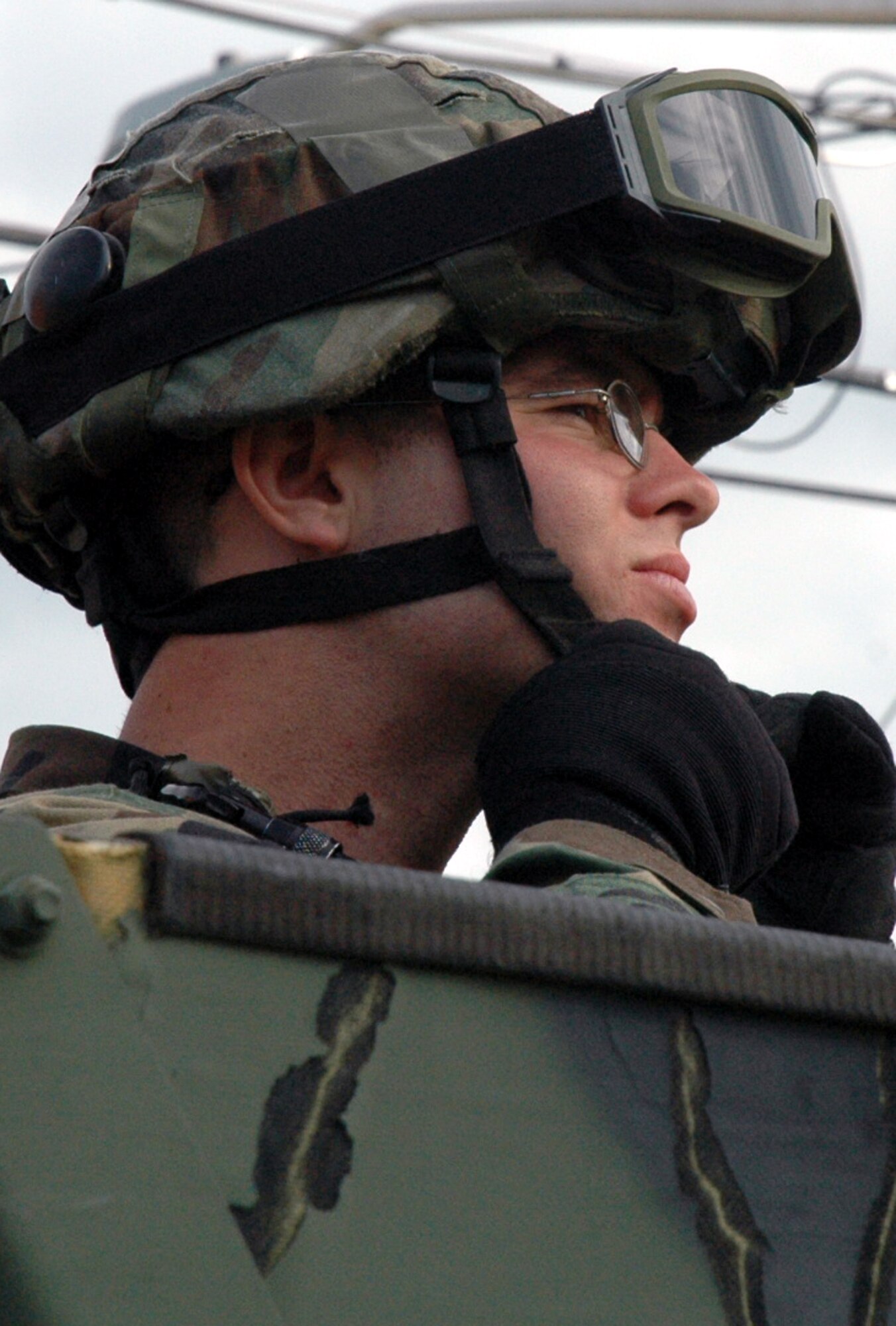 A student in the Air Force Phoenix Warrior Training Course 08-1 snaps on his helmet strap while preparing for a convoy out to training for the course Oct. 16 at Fort Dix, N.J.  Phoenix Warrior is a course designed to prepare Air Force security forces Airmen prior to deployment.  The course is taught by the U.S. Air Force Expeditionary Center's 421st Combat Training Squadron. (U.S. Air Force Photo/Tech. Sgt. Scott T. Sturkol)