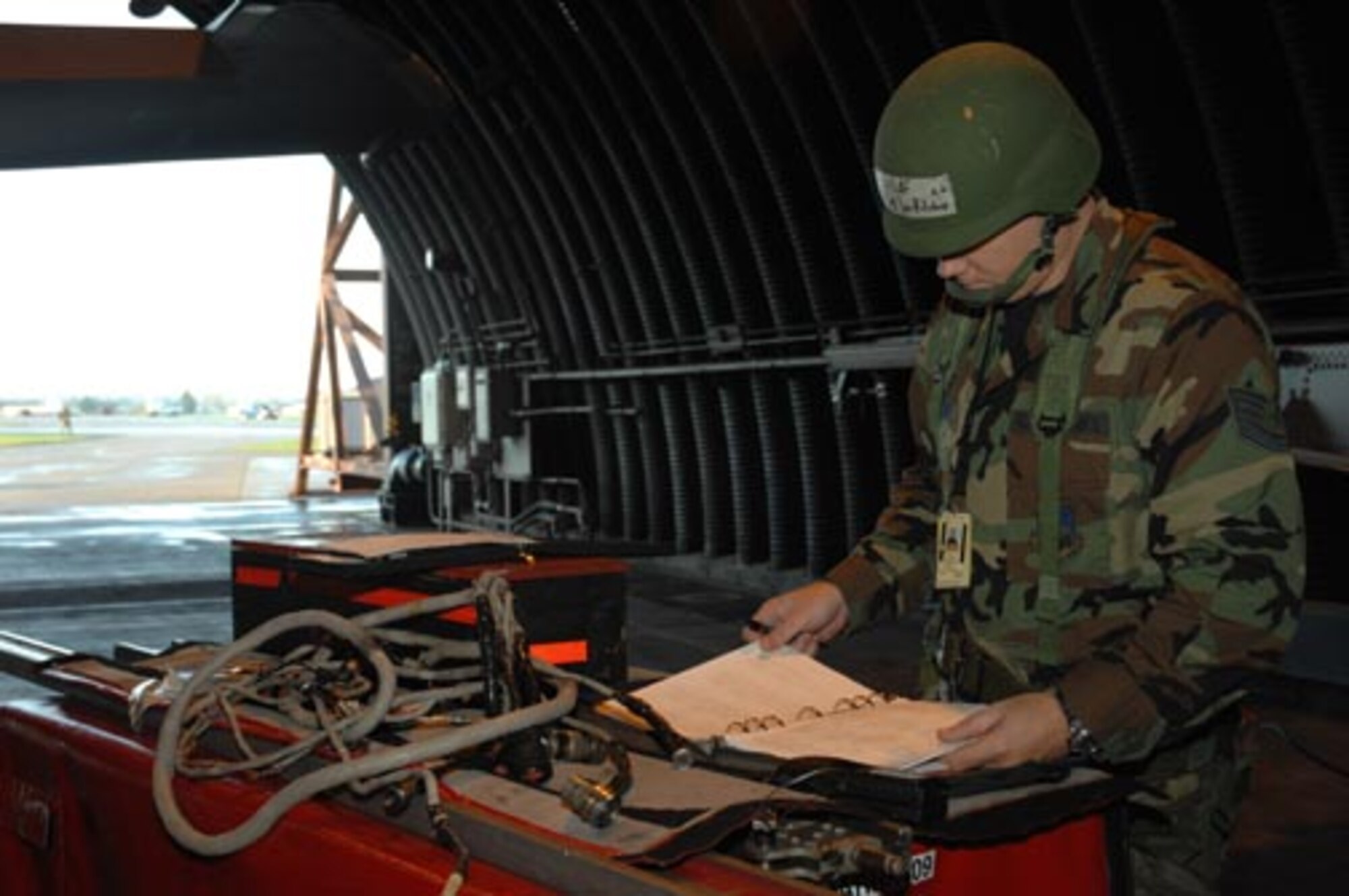 Tech. Sgt. Jonathon Ritchie, 48th Munitions Squadron and member of the exercise evaluations team, prepares for a scenario involving a simulated mortar attack on the base during a local NATO Tactical Evaluation Exercise on Oct. 17. (U.S. Air Force photo by Airman 1st Class John Easterling)