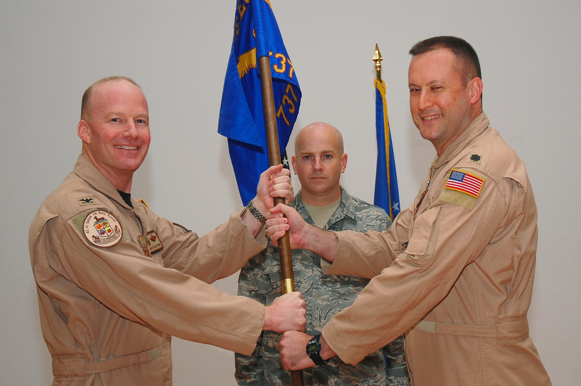 SOUTHWEST ASIA -- 737th Expeditionary Airlift Squadron change of command.  Lt. Col. Brian Yates assumes command of the squadron from Lt. Col. David Knight at an undisclosed location Oct. 17.  (U.S. Air Force photo by Staff Sgt. Tia Schroeder)