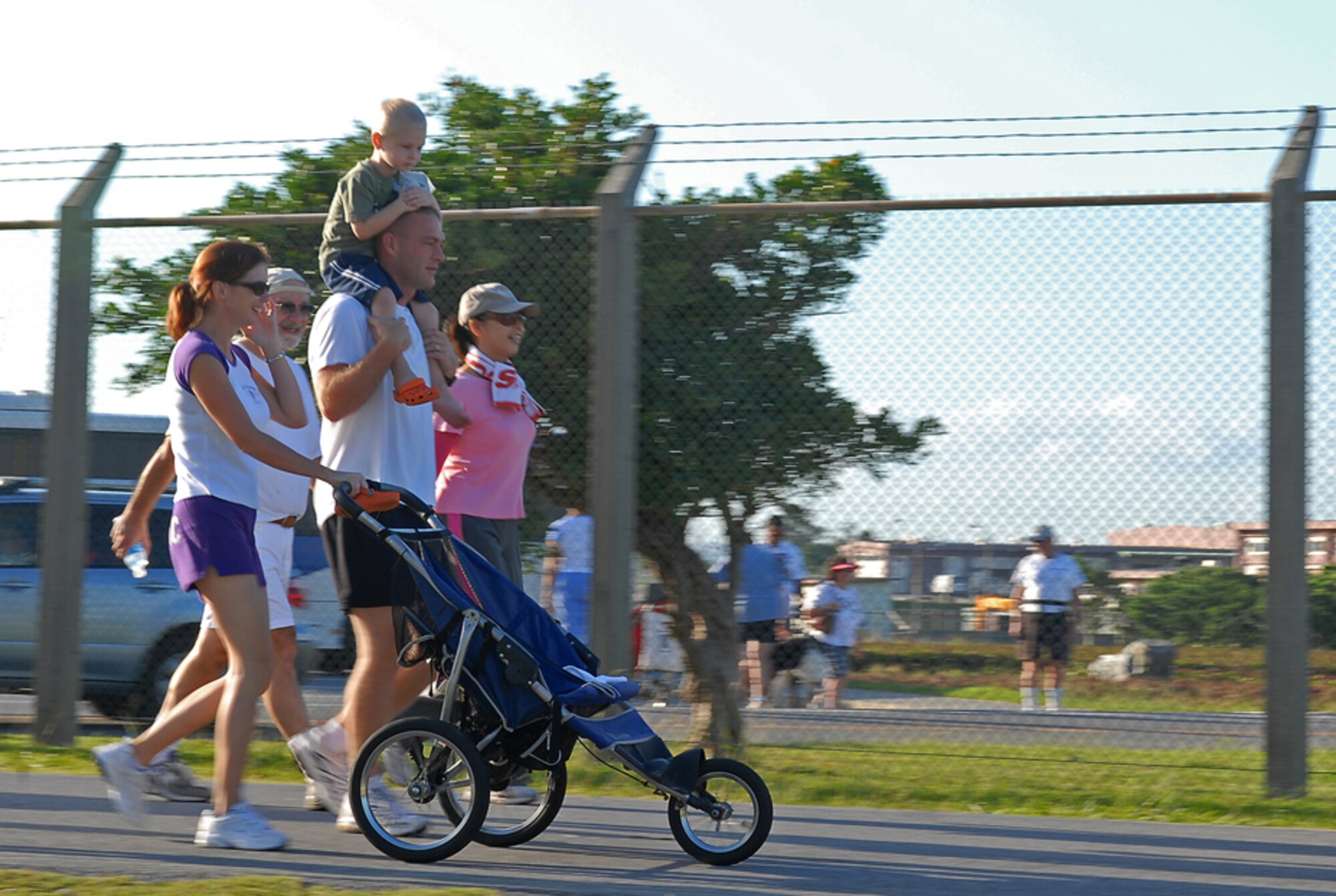 071013-F-4022T-109
Capt. Jason Murtha and his family participate in the 4th Annual Domestic Violence Awareness Run/Walk held at Torii Station, Japan, Oct. 13, 2007. Locals, service members of the United States military forces, and Girl Scout troops came from all over the island to participate in the 5K run and walk meant to raise awareness and stop domestic violence in the military community. Captain Murtha is from the Marine Air Support Squadron-2 at Camp Futenma.
(U.S. Air Force/Airman 1st Class Kelly Timney)