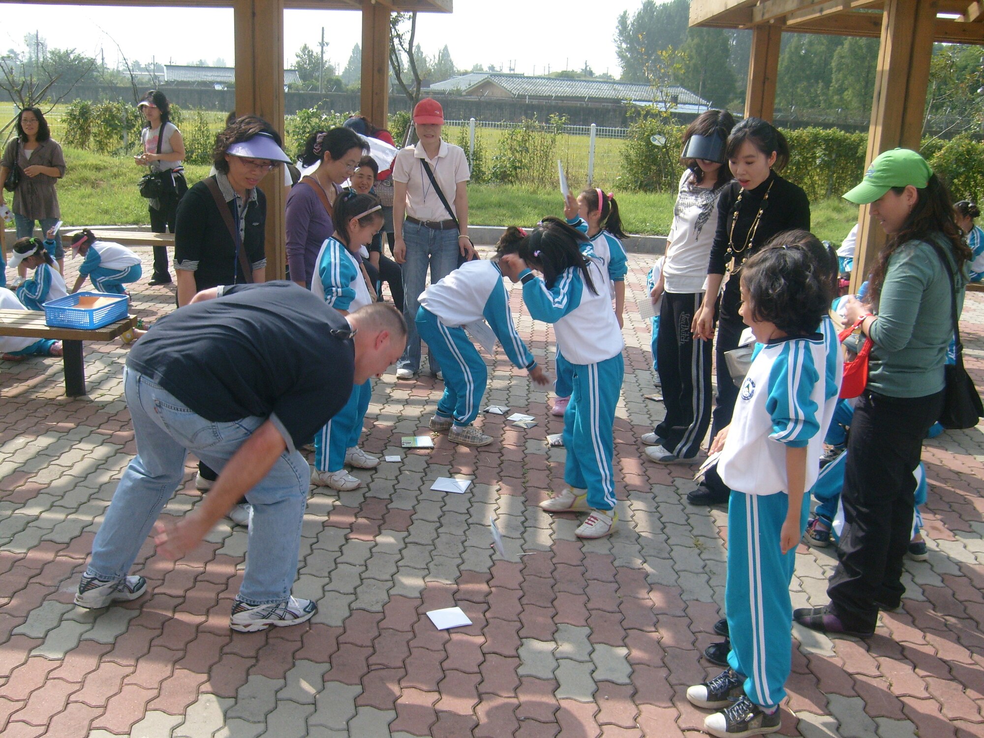 The Do-San Elementary School in Gwang Ju, ROK, invited personnel from Detachment 1, 607th Materiel Maintenance Squadron, to their annual Autumn Sports Day.  The students and Det 1 personnel participated in a variety of activities such as tug-of- war, wheel and stick, and the traditional Korean see-saw. Det 1 members are no strangers to the local community.  Since September 2006, members have volunteered to teach English to the children at Do-San Elementary three times a month as part of the Good Neighbor Program.  Activities like this greatly improve the students’ English ability, help foster a good relationship with the local Gwang Ju community, and also give our detachment members an experience they will never forget. (photo by Ki Hyun Pak ) 