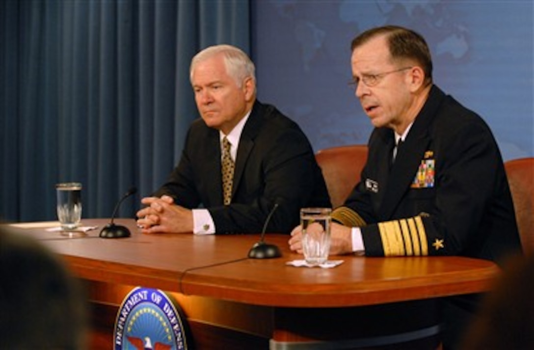 Chairman of the Joint Chiefs of Staff Adm. Mike Mullen (right), U.S. Navy, responds to a reporter's question during his first joint media roundtable with Secretary of Defense Robert M. Gates in the Pentagon on Oct. 18, 2007.  