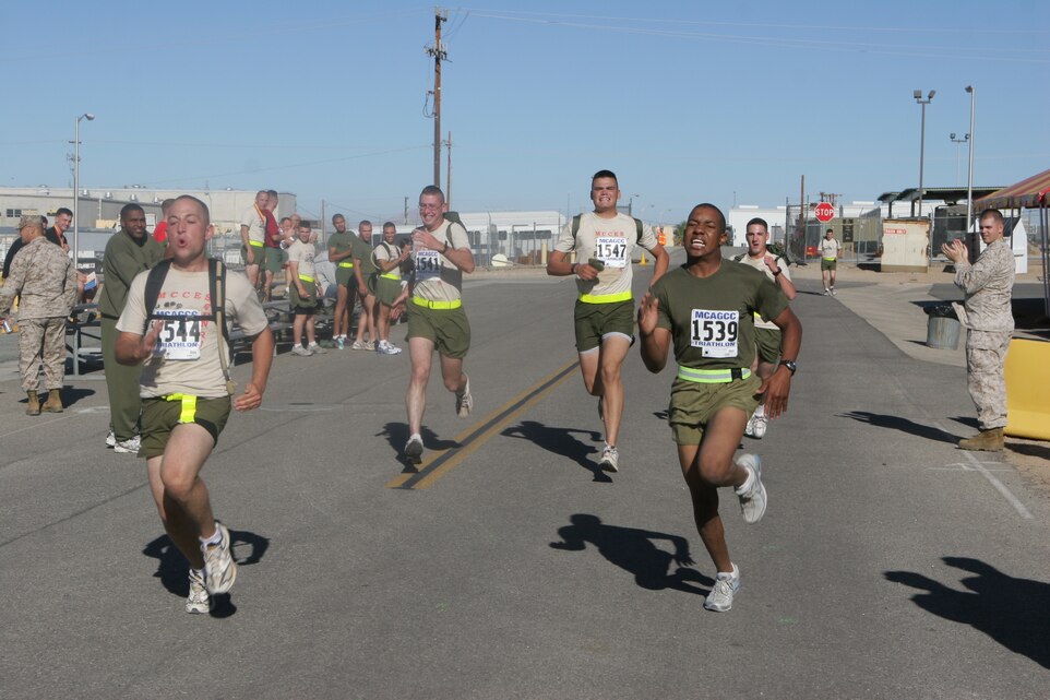 The 4th Marine Corps Communication-Electronics School Fun Run participants stretch it out and sprint to the finish line of the half-marathon in front of Combat Center building 1831 Oct. 19.