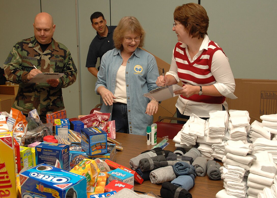 Master Sgt. Michael O’Donnell, 1st Fighter Wing Chapel superintendent, Lynn Torrenti , Protestant parrish coordinator and Joanna McCormack, Catholic coordinator, take inventory of donations at the Bethel Manor Chapel Oct. 17. The items, which were donated by dorm residents, the Catholic and Protestant parishes and local Airmen, will be used will be shipped to deployed Air Force chaplains in Balad and Afghanistan. From there, items such as snacks, DVDs, game systems and clothing will be distributed to deployed servicemembers. (U.S. Air Force photo/Staff Sgt. Katrina Shellman)
