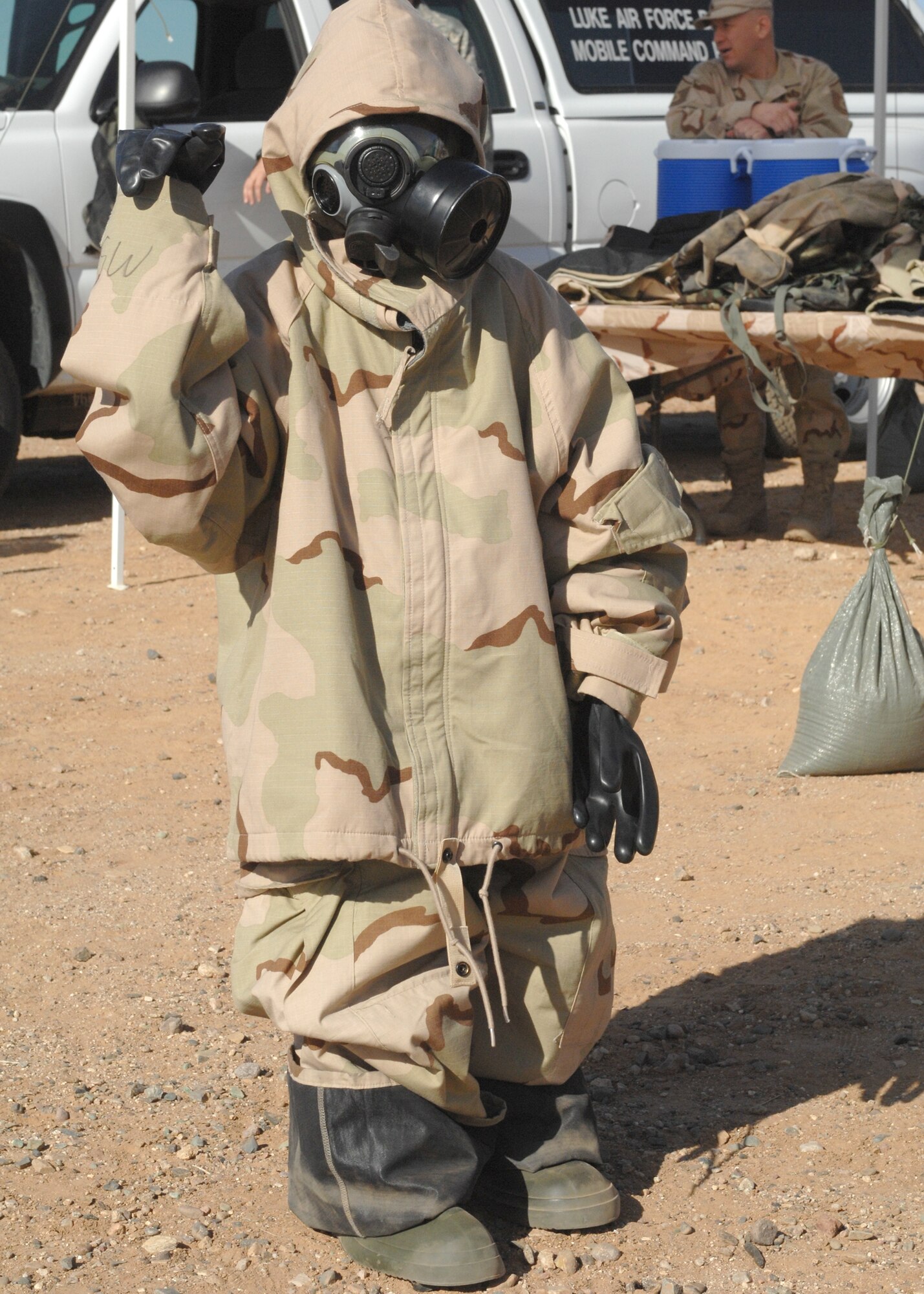 Dayton Jarquin, 6, gets his turn in the mission-oriented protective posture level four or MOPP 4 gear, during Operation KIDS Oct. 13. (photo by Tech. Sgt. Raheem Moore)