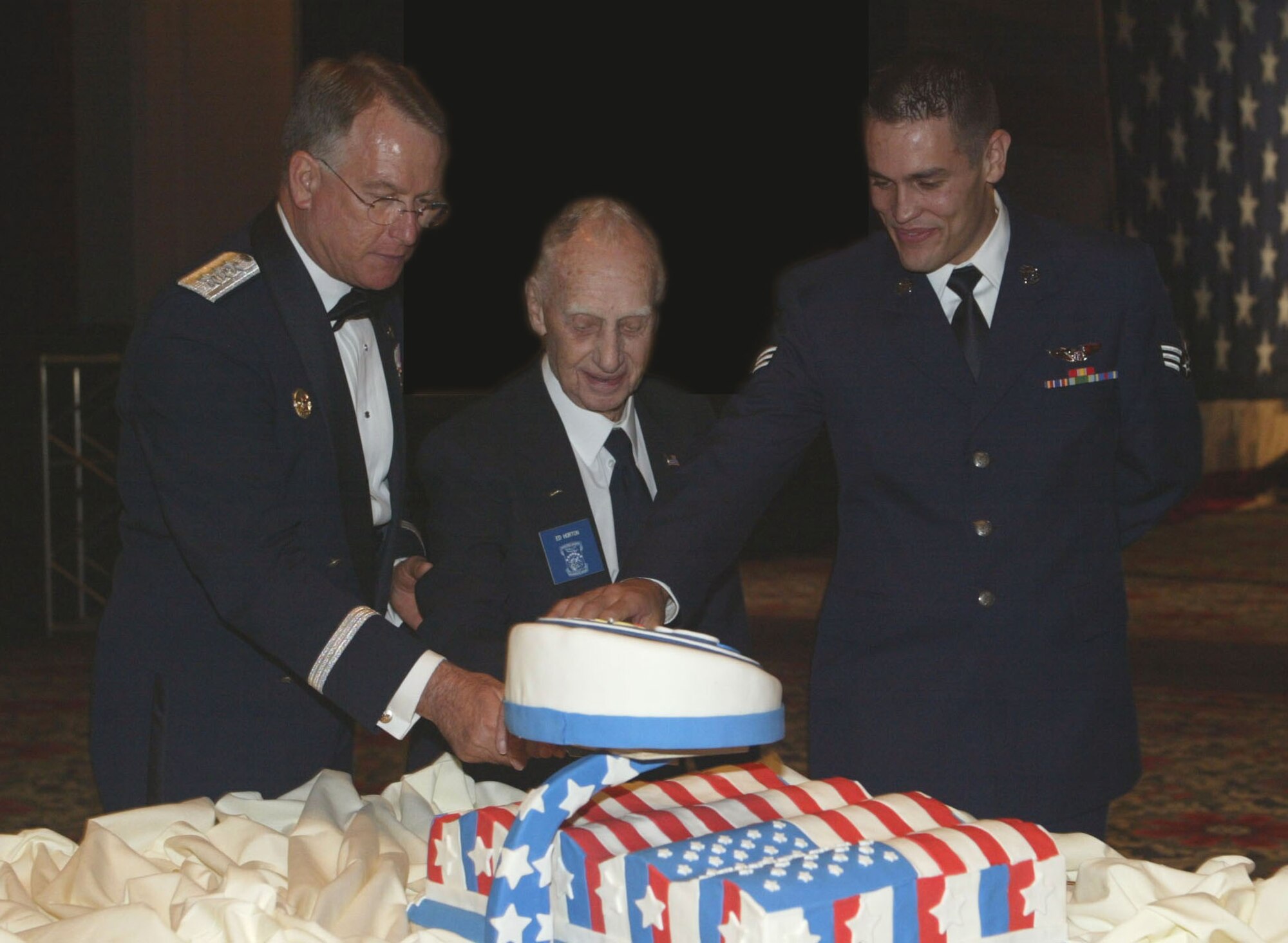 (left to right) Lt. Gen. John A. Bradley, Air Force Reserve Command commander, retired Master Sgt. Edwin Horton, World War II veteran of the Doolittle Raid mission, and Senior Airman Anthony Toste, 700th Airlift Squadron loadmaster, cut a commemorative cake during the 2007 Air Force Ball held at the Cobb Galleria in Marietta, Georgia.  The ball climaxed the Air Force Week Atlanta activities held Oct. 8-14.  