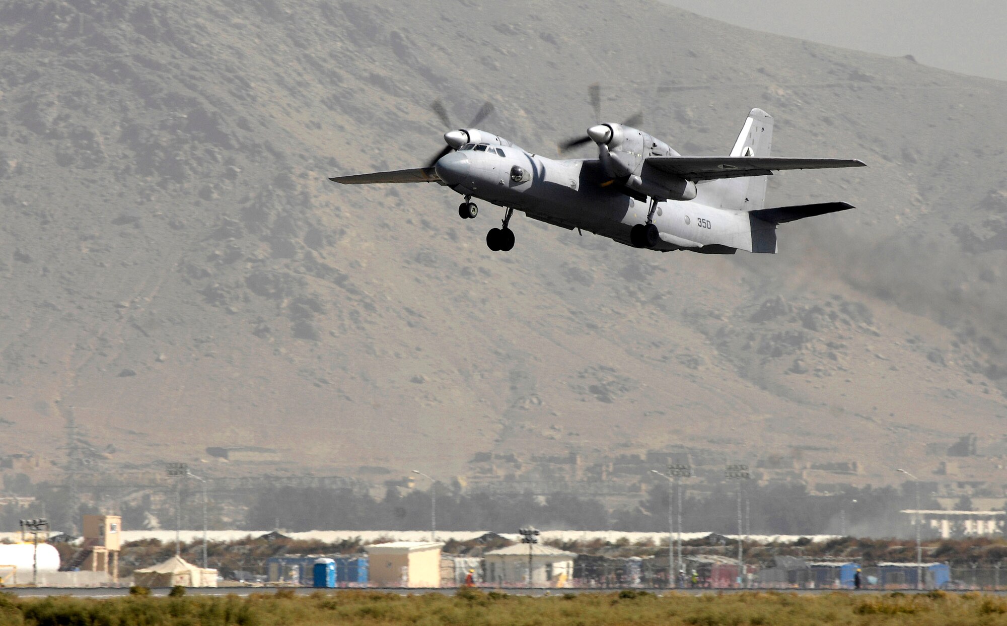 An Afghan national army air corps AN-32 cargo plane takes off Oct. 18 at Kabul International Airport, Afghanistan. The plane's mission is to fly winter supplies to ANA troops in Kandahar. The ANA air corps has been able to fly more cargo to support their own troops due to the recent introduction and training of aircraft loadmasters. 
(U.S. Air Force photo/Staff Sgt. Brian Ferguson)