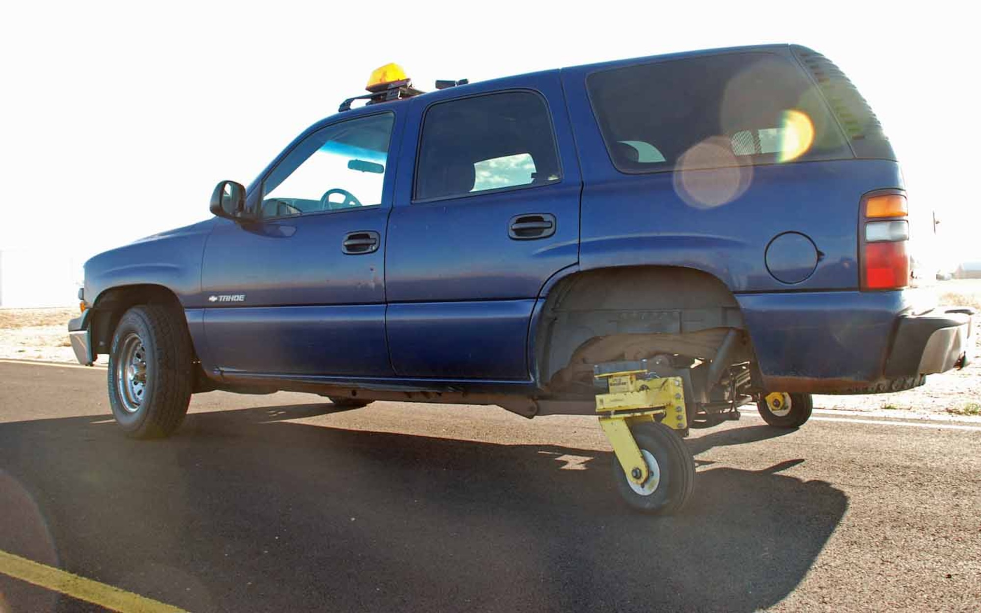 The 90th Space Wing safety office introduced a vehicle in 2003 to reduce the amount of serious vehicle mishaps. The back two tires on the 'skid monster' were replaced with caster airplane tires. It operates like a normal vehicle until the 'monster' switch is thrown, which allows the airplane tires to rotate 360 degrees (Photo by Airman 1st Class Daryl Knee).