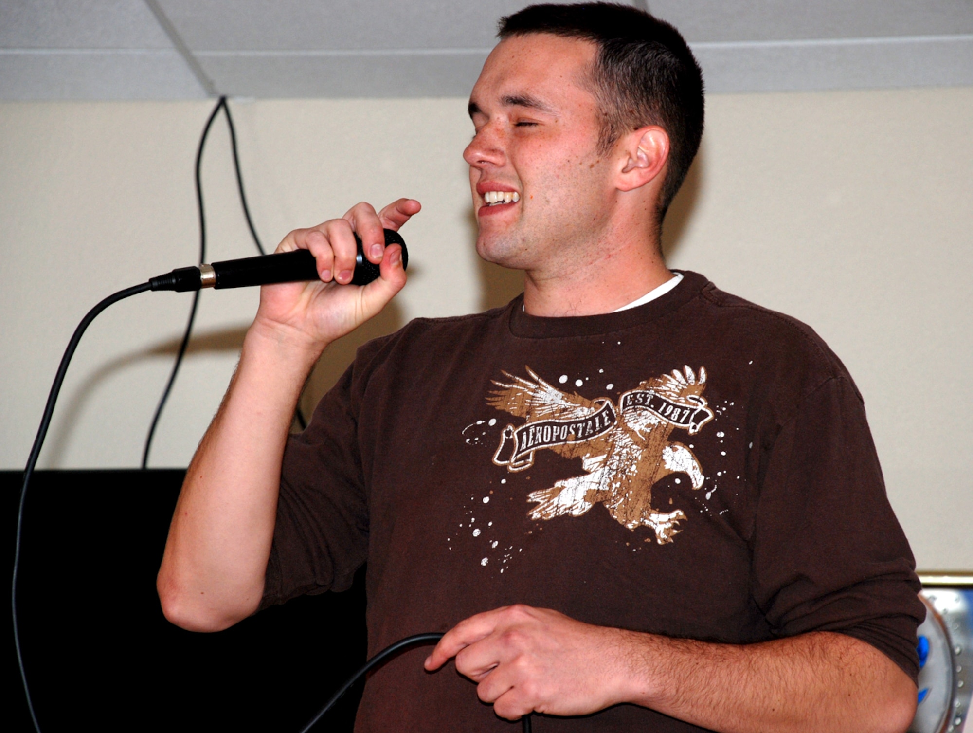 Senior Airman Justin Old, 90th Maintenance Operations Squadron, performs the song “Only God Knows Why” by Kid Rock during the opening night of Warren Idol 2. The category of the night was singer’s choice. All participants made it through to the second round which takes place tonight in the Trail’s End club (Photo by Airman Alex Martinez).
