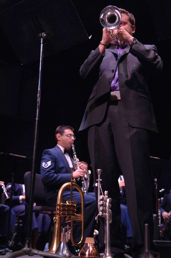 A member of the Boston Brass performs alongside the Air Force Band of the Golden West during an Oct. 17 performance at the University of Nevada Las Vegas . The Band of the Golden West, from Travis Air Force Base, Calif., is the only active duty Air Force band west of the Rocky Mountains. They are scheduled to perform five free concerts in the Las Vegas community. The band supports 10 active duty Air Force bases, five Air Force Reserve wings and five recruiting squadrons in California, Washington, Oregon, Idaho and Nevada with more than 500 annual performances. (U.S. Air Force photo/Senior Airman Larry E. Reid Jr.)