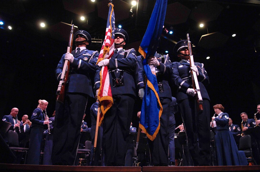 The Nellis Air Force Base Honor Guard presents the colors during the opening of the Air Force Band of the Golden West performance Oct. 17 at the University of Nevada Las Vegas. The Band of the Golden West, from Travis Air Force Base, Calif., is the only active duty Air Force band west of the Rocky Mountains. They are scheduled to perform five free concerts in the Las Vegas community. The band supports 10 active duty Air Force bases, five Air Force Reserve wings and five recruiting squadrons in California, Washington, Oregon, Idaho and Nevada with more than 500 annual performances. (U.S. Air Force photo/Senior Airman Larry E. Reid Jr.) 