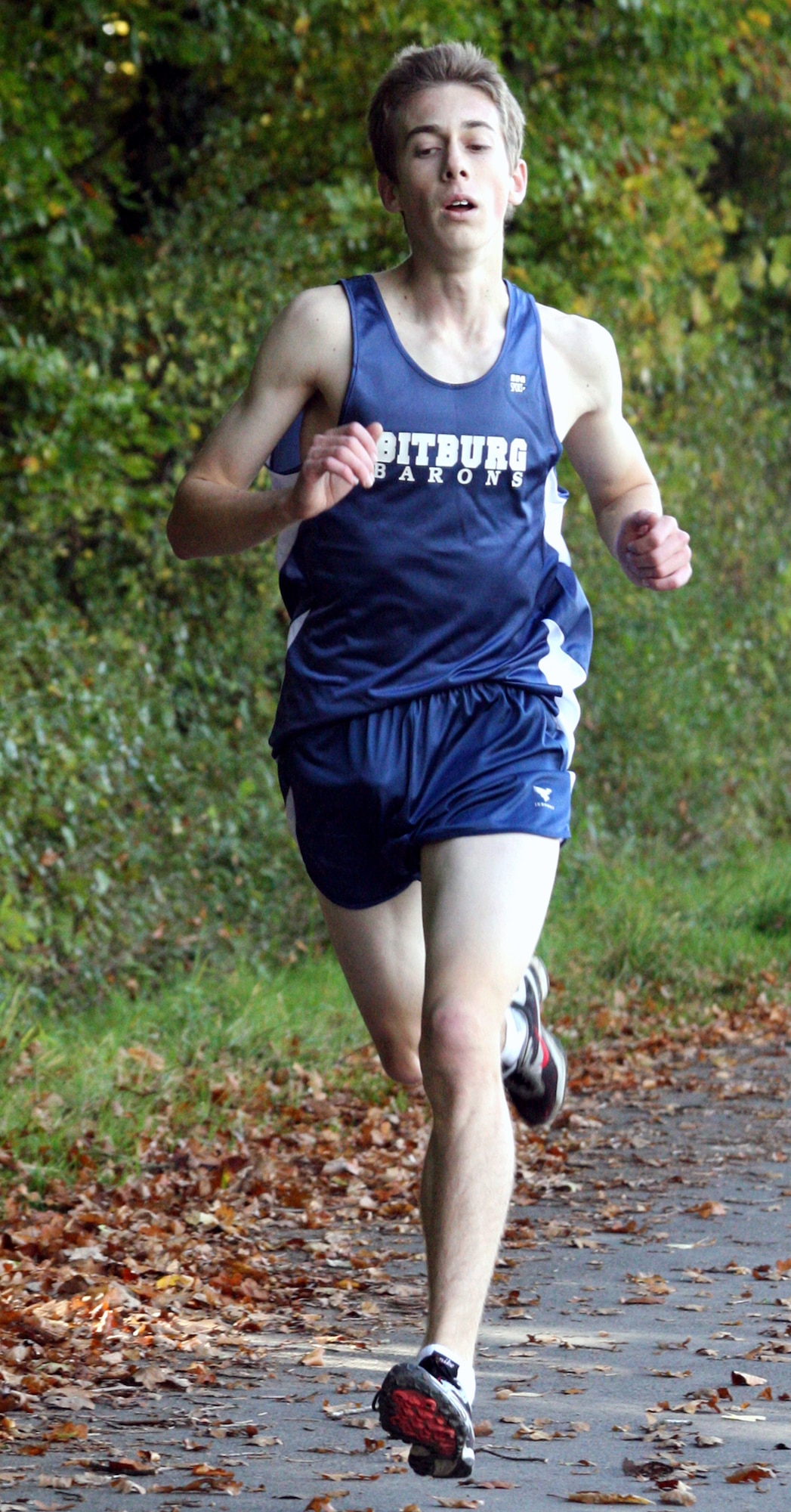 BITBURG-MOETSCH, Germany – After an emotional beginning of the season, Bitburg High School runner Ryan Poock, a senior, secured his position as the fastest male runner in Europe at a home cross country meet Oct. 13. Poock finished in 16 minutes, 20 seconds, a personal record, and 67 seconds faster than the previous course record. (U.S. Air Force photo/Rob Meehan)