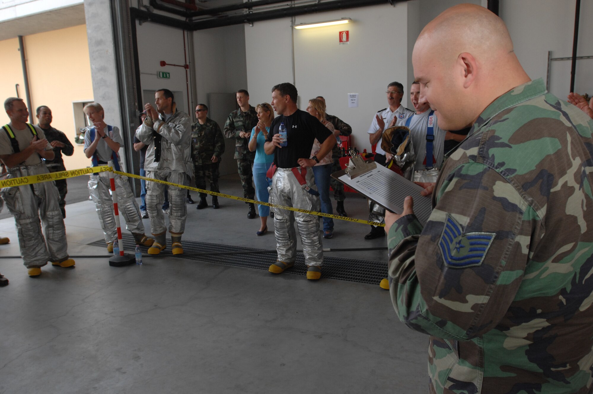 AVIANO AIR BASE, Italy-- Tech. Sgt. Mark Belton, 31st Civil Engineer Squadron, tallies the points at the commander's firefighter's challenge Oct. 12, 2007.  Group and squadron commanders got together to celebrate Fire Safety Week by competing in various firefighting obstacle courses.  (U.S. Air Force photo by Airman 1st Class Nathan Doza ) 