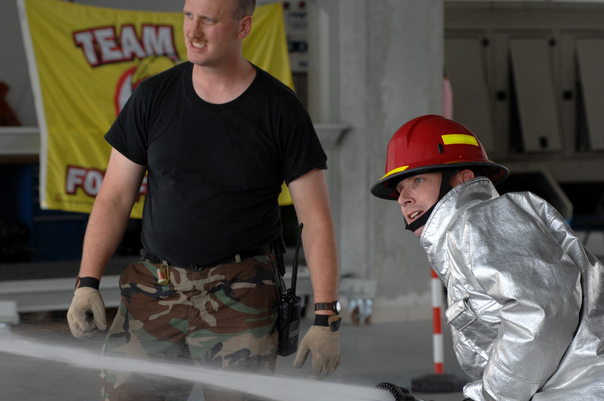 AVIANO AIR BASE, Italy-- Col Thomas Gould, 31st Operations Group commander, competes in the commander's Firefighter's Challenge Oct. 12, 2007.  Group and Squadron commanders got together to celebrate Fire Safety Week by competing in various firefighting obstacle courses.  (U.S. Air Force photo by Airman 1st Class Nathan Doza)