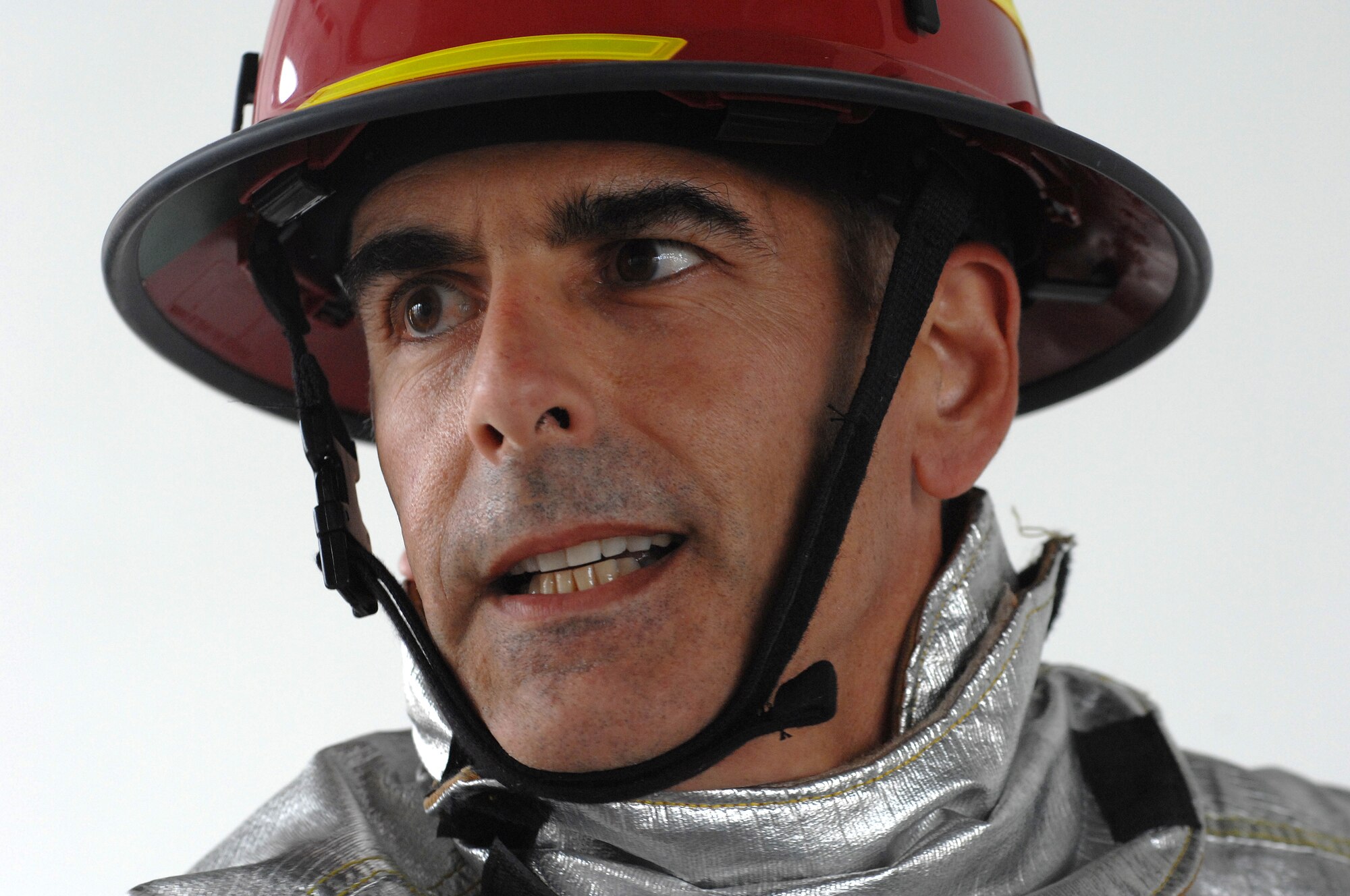 Aviano Air Base, Italy-- Lt. Col. Sal Cutino, 31st Dental Squadron Commander, competes in the Commander's Firefighter's Challenge Oct. 12, 2007.  Group and Squadron commanders got together to celebrate Fire Safety Week by competing in various firefighting obstacle courses.  ( U.S. Air Force photo/Airman First Class Nathan Doza ) ( Released )