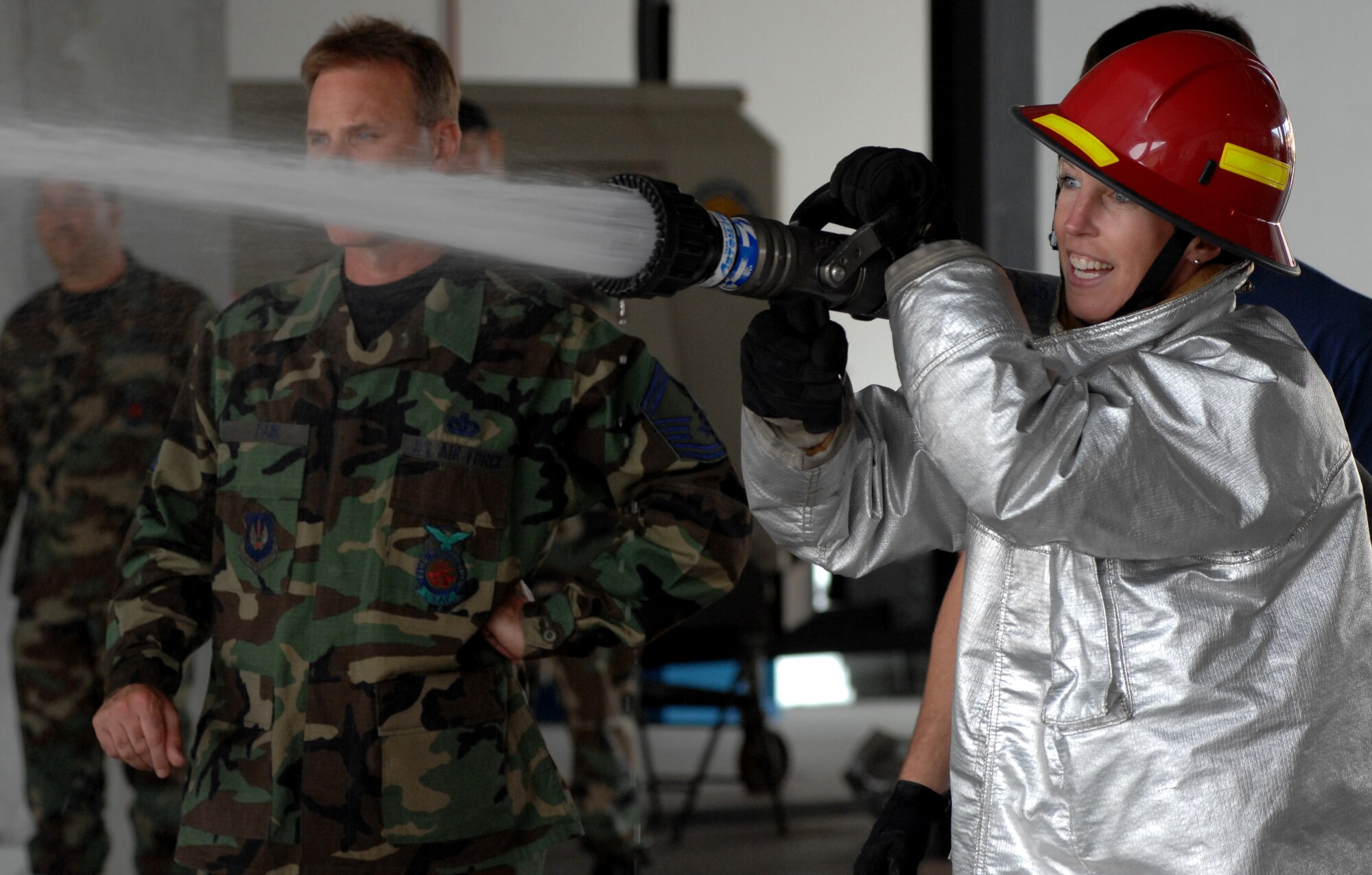 AVIANO AIR BASE, Italy-- Lt. Col. Beth Brown, 31st Fighter Wing, Civil Engineer Squadron commander, competes in the Commander's Firefighter's Challenge Oct. 12, 2007.  Group and Squadron commanders got together to celebrate Fire Safety Week by competing in various firefighting obstacle courses.  ( U.S. Air Force photo/Airman 1st Class Nathan Doza)