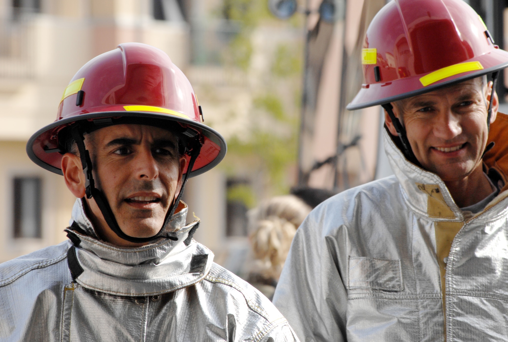 AVIANO AIR BASE, Italy-- Lt. Col. Sal Cutino, 31st Dental Squadron commander and Lt. Col. Greg Brown, 31 Mission Support Squadron commander, compete in the Commander's Firefighter's Challenge Oct. 12, 2007.  Group and Squadron commanders got together to celebrate Fire Safety Week by competing in various firefighting obstacle courses.  ( U.S. Air Force photo/Airman 1st Class Nathan Doza) 