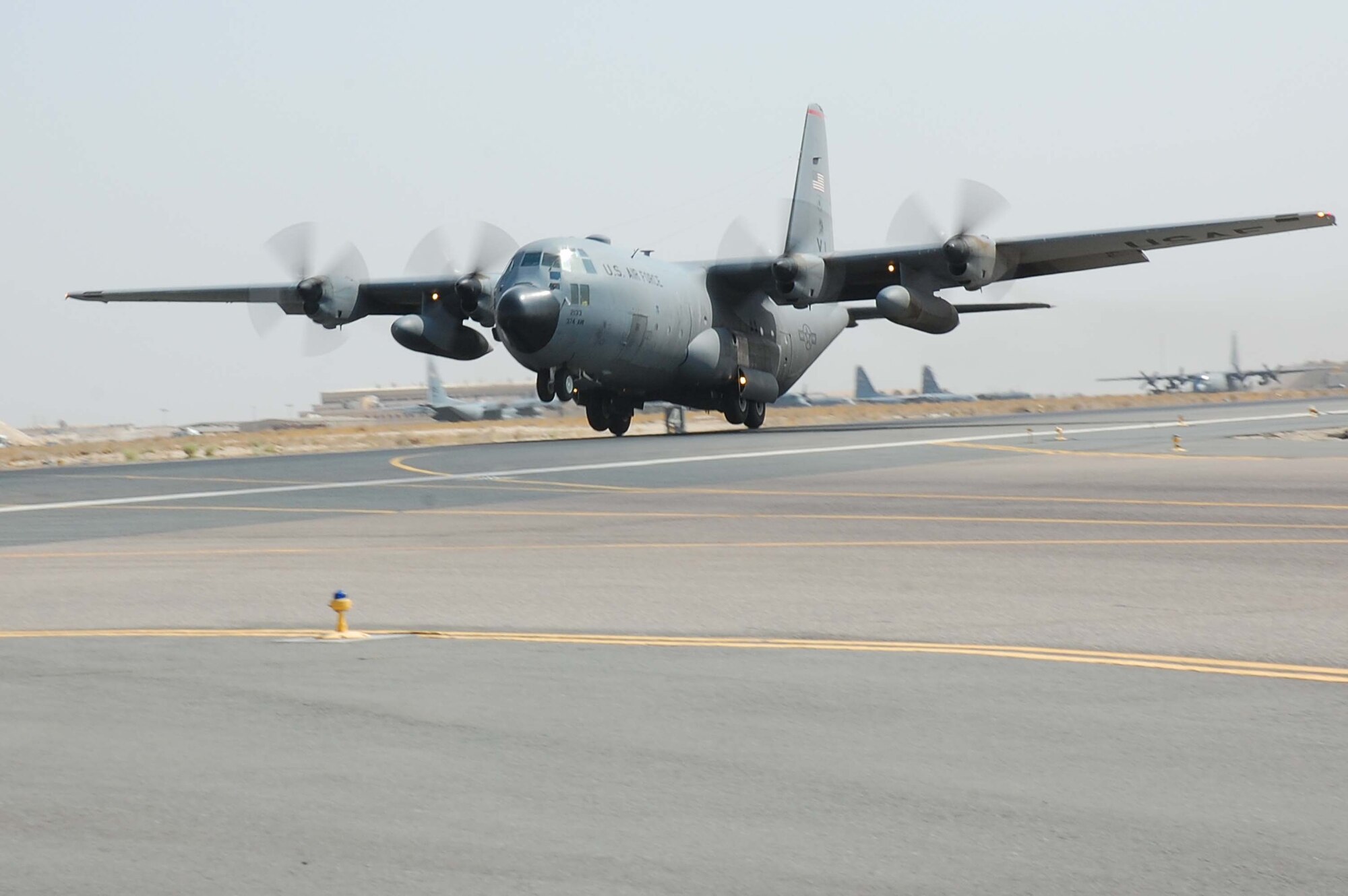 SOUTHWEST ASIA -- A C-130E Hercules aircraft prepares for take-off here Oct. 19. The C-130 Hercules primarily performs the tactical portion of the airlift mission. The aircraft is capable of operating from rough, dirt strips and is the prime transport for air dropping troops and equipment into hostile areas.  (U.S. Air Force photo by Staff Sgt. Tia Schroeder)