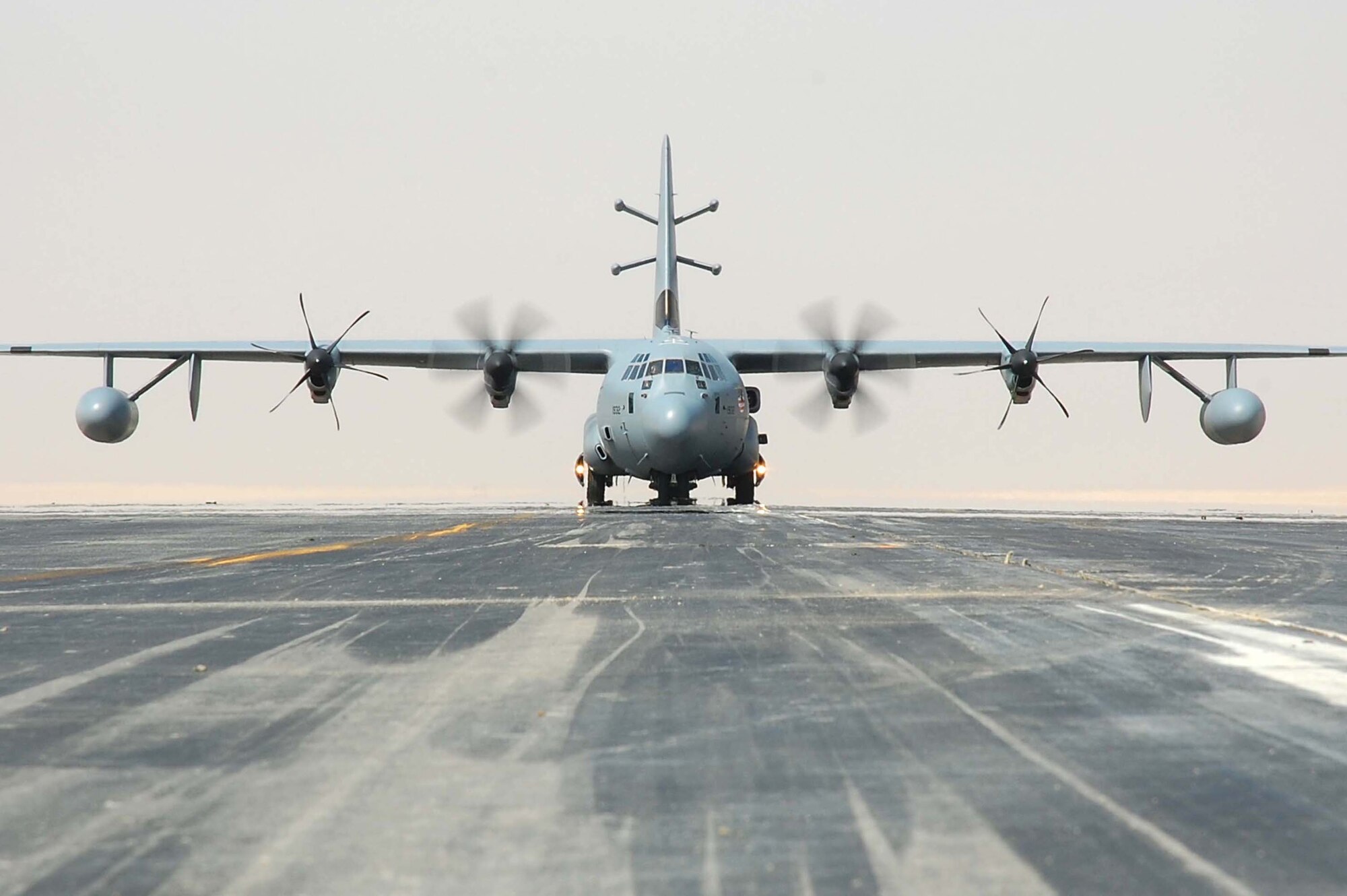 SOUTHWEST ASIA -- An EC-130J Commando Solo aircraft taxis down the runway here Oct. 19.  The EC-130J conducts information operations, psychological operations, and civil affairs broadcasts in AM, FM, HF, TV and military communications bands. (U.S. Air Force photo by Staff Sgt. Tia Schroeder)