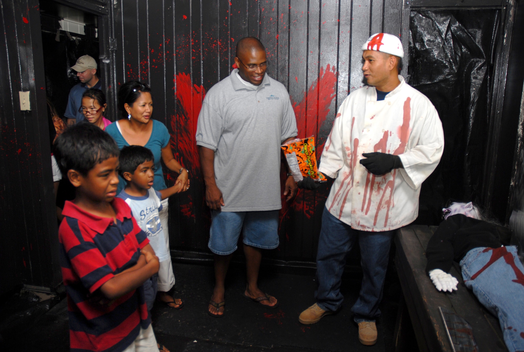 Special Agent Perryn Collier, Federal Bureau of Investigations, and his family visit the 36th Civil Engineering Squadron's haunted house in base housing Oct. 20.  (U.S. Air Force photo/Senior Airman Miranda Moorer)