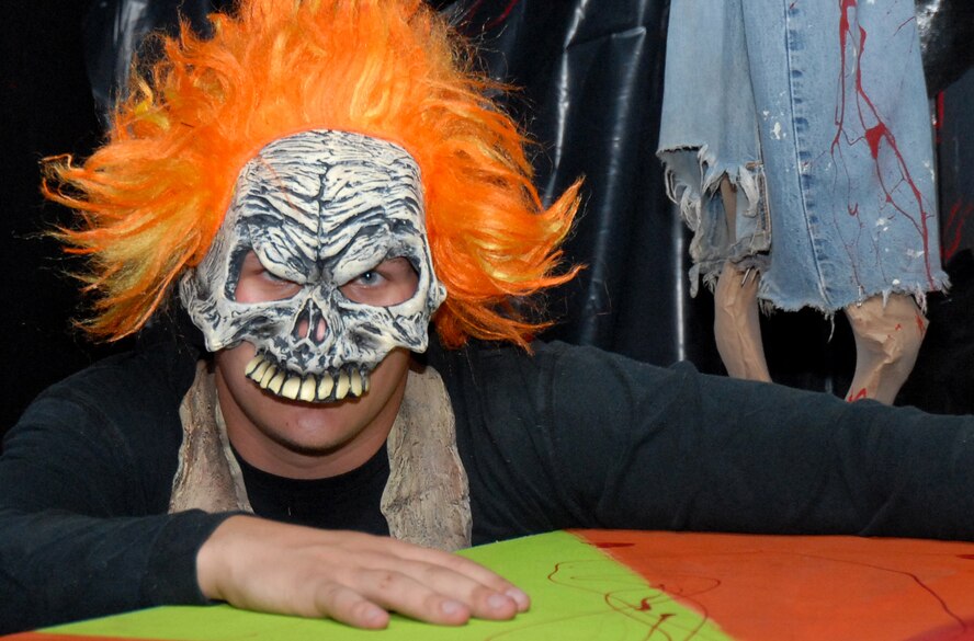 Airman 1st Class Thane Adams, 36th Civil Engineering Squadron, poses as a scary clown in a haunted house set up in base housing Oct. 19.  The (U.S. Air Force photo/Senior Airman Miranda Moorer)