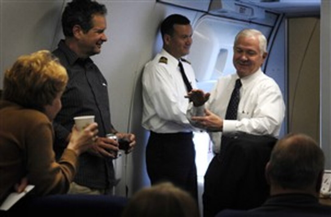 Defense Secretary Robert M. Gates speaks with members of the press onboard an E4-B National Airborne Operation Center aircraft on the way to Kyiv, Ukraine, Oct. 21, 2007.