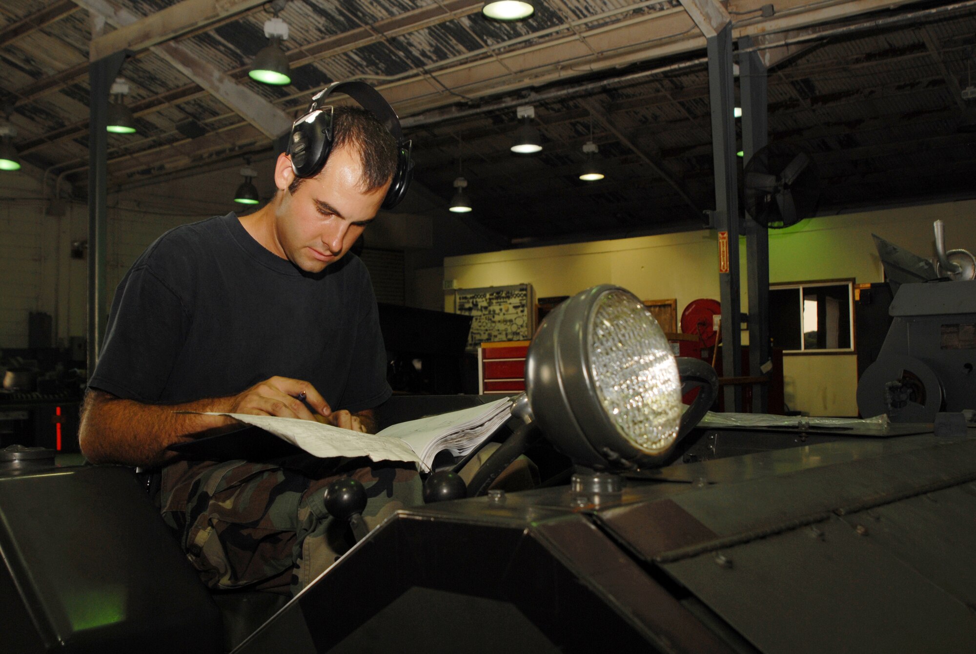 Staff Sgt. Christopher Pugh, 18th Equipment Maintenance Squadron, troubleshoots and documents maintenance forms for a piece of aircraft ground equipment during Local Operational Readiness Exercise Beverly High 08-1 Oct. 22. (U.S. Air Force photo/Staff Sgt. Chriss FitzGerald)