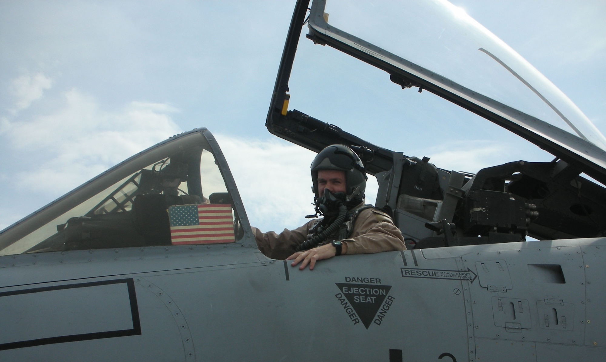 Capt. Dennis Hargis sits in the cockpit of his A-10 Thunderbolt II at Bagram Air Base, Afghanistan.  The captain recently came to the aid of a friendly convoy under attack in what he describes as "one of the most intense and memorable experiences of my life."  Captain Hargis is assigned to the 354th Expeditionary Fighter Squadron.  (Courtesy photo)
