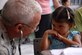 CUESTA DE LA VIRGEN, Honduras -- Army Lt. Col. (Dr.) Michael Hoilien, assigned to the Medical Element at Soto Cano Air Base, examines a Honduran child during a Medical Readiness Training Exercise here Oct. 19.  This MEDRETE educated 785 Hondurans on preventive medicine issues such as hand washing, food preparation and personal hygiene.  Of those 785, doctors examined 352 patients and the dentist treated 139 patients.  (U.S. Air Force photo/1st Lt. Erika Yepsen)
