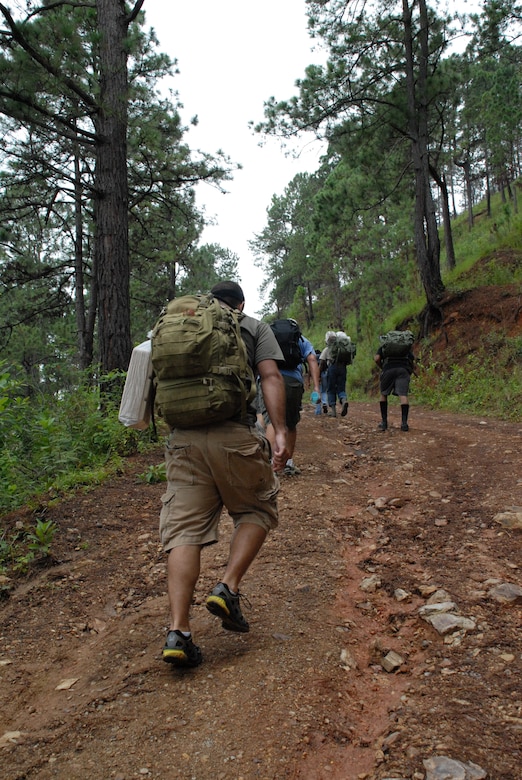 ALDEA BELLA VISTA, Honduras -- U.S. military members of Joint Task Force Bravo from Soto Cano Air Base make their way up Comayagua Mountain Oct. 20 to bring food to people in the remote village of Bella Vista.  Approximately 50 military men and women participated in the hike, climbing more than 3,000 feet to bring 450 pounds of food to citizens in Bella Vista.  The hike was the second in a series of five planned by the JTF-Bravo chaplain to support local Hondurans. (U.S. Air Force photo/1st Lt. Erika Yepsen)