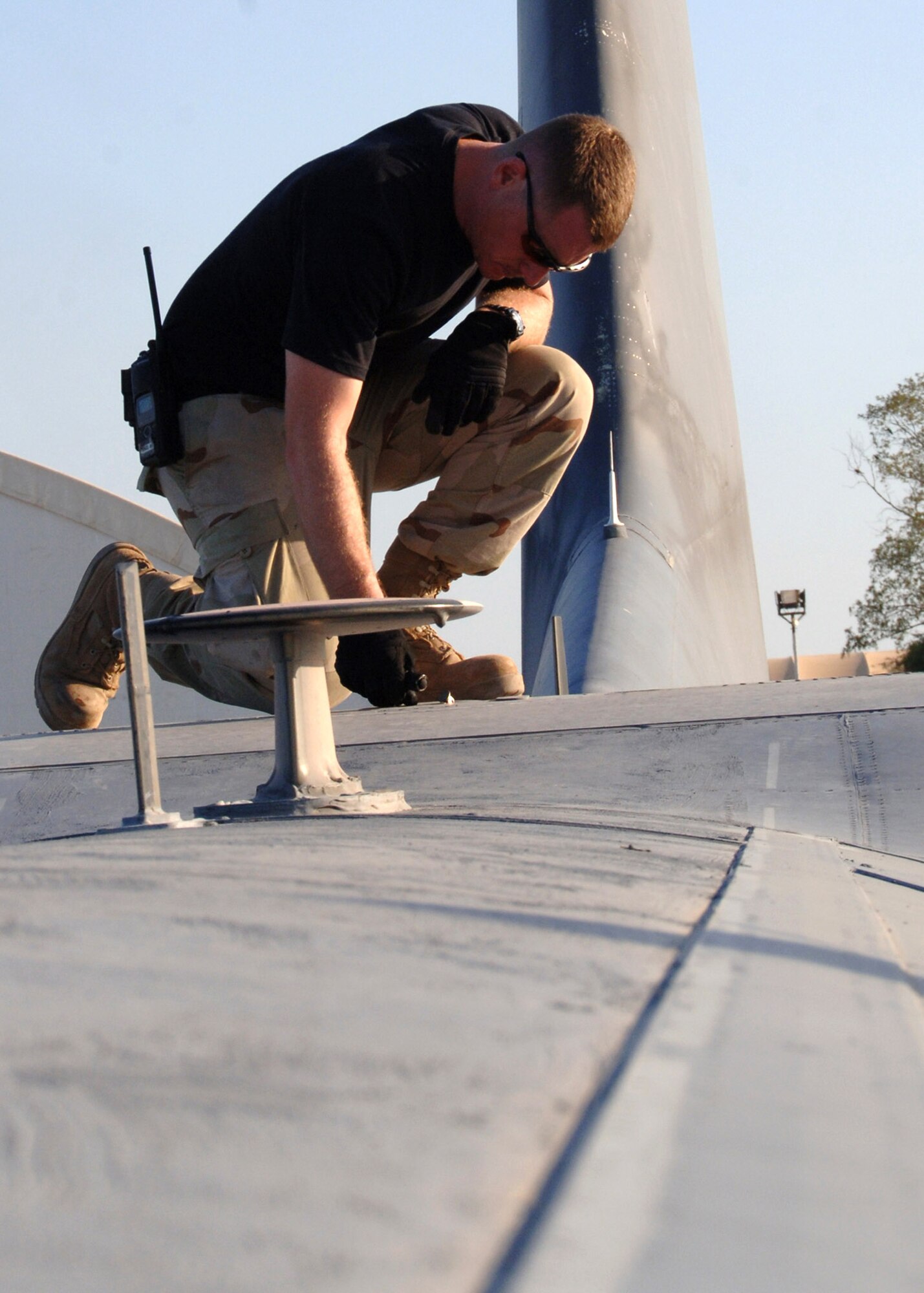 Staff Sgt. James Rodman inspects the top wings of a C-130 Hercules as part of a preflight inspection Oct. 22 at Camp Lemonier, Djibouti. Sergeant Rodman is a crew chief for the 81st Expeditionary Rescue Squadron. (U.S. Navy photo/Petty Officer 2nd Class Regina L. Brown)
