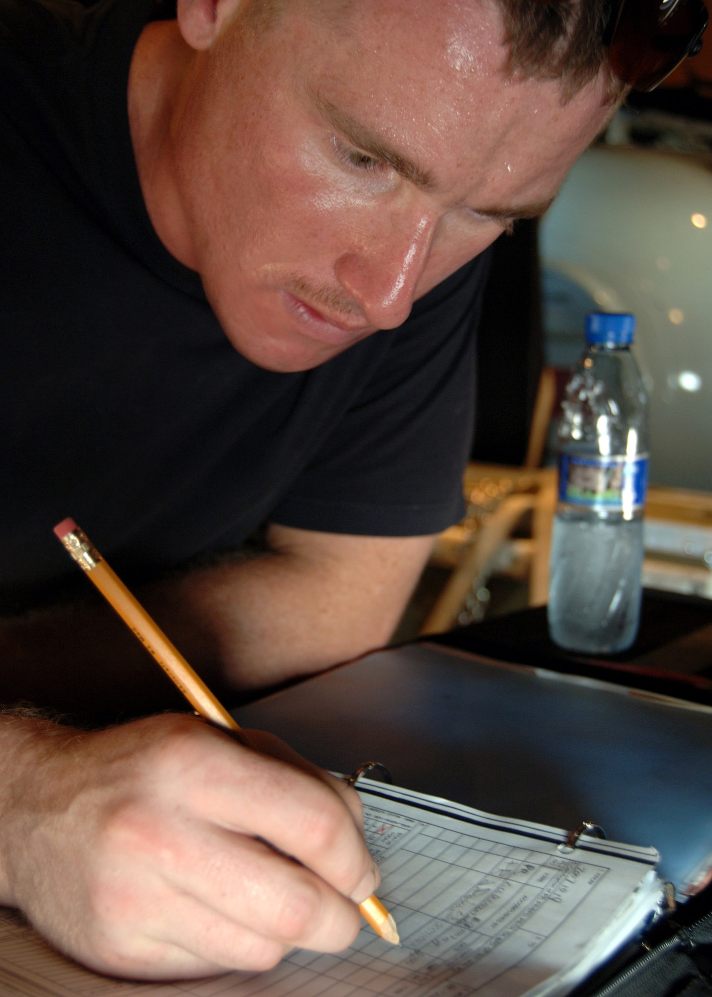 Staff Sgt. James Rodman documents a preflight inspection that was completed on a C-130 Hercules Oct. 22 at Camp Lemonier, Djibouti. Sergeant Rodman is a crew chief for the 81st Expeditionary Rescue Squadron. (U.S. Navy photo/Petty Officer 2nd Class Regina L. Brown) 
