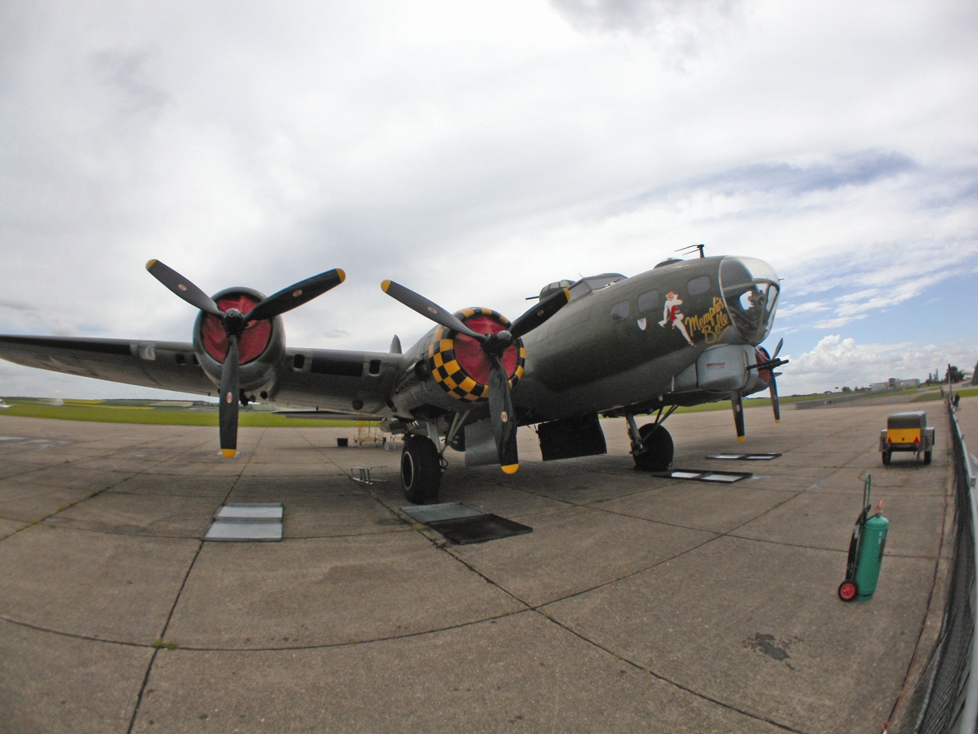 Sally B, the only airworthy B-17 Flying Fortress in the United Kingdom, rests on the tarmac at Imperial War Museum Duxford, England. Its proper name is painted on one side of the nose, while Memphis Belle is on the other (shown) due to its use in the 1990 movie of that name. (U.S. Air Force photo by Senior Master Sgt. Matt Proietti)