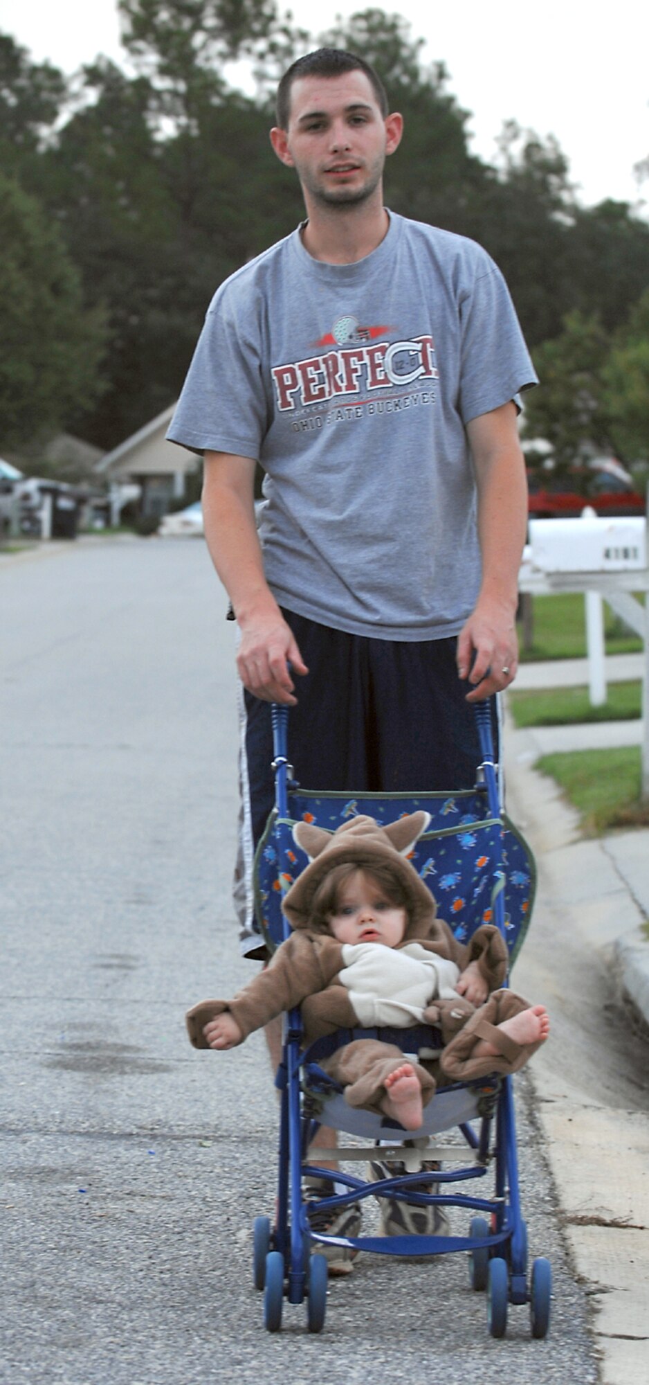 Tim Barker, spouse of Airman 1st Class Brittany Barker, takes his costumed daughter for a stroll around the neighborhood recently. As Team Moody prepares for the upcoming Halloween season, the 23rd Wing Safety Office is advising people to be cautious when planning their festivities. (U.S. Air Force photo by Airman 1st Class Brittany Barker)