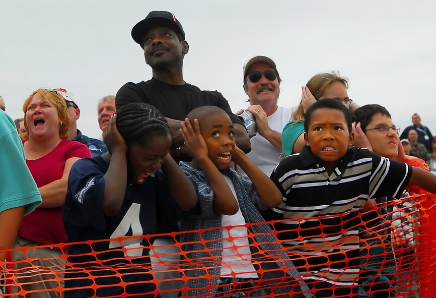 MOODY AIR FORCE BASE, Ga. -- Members of the crowd react during the dreaded Thunderbird "sneak pass" at the Team Moody AirFest 07' Oct 21.  The two-day event drew an estimated 50,000 spectators. (U.S. Air Force photo by Tech. Sgt. Parker Gyokeres)