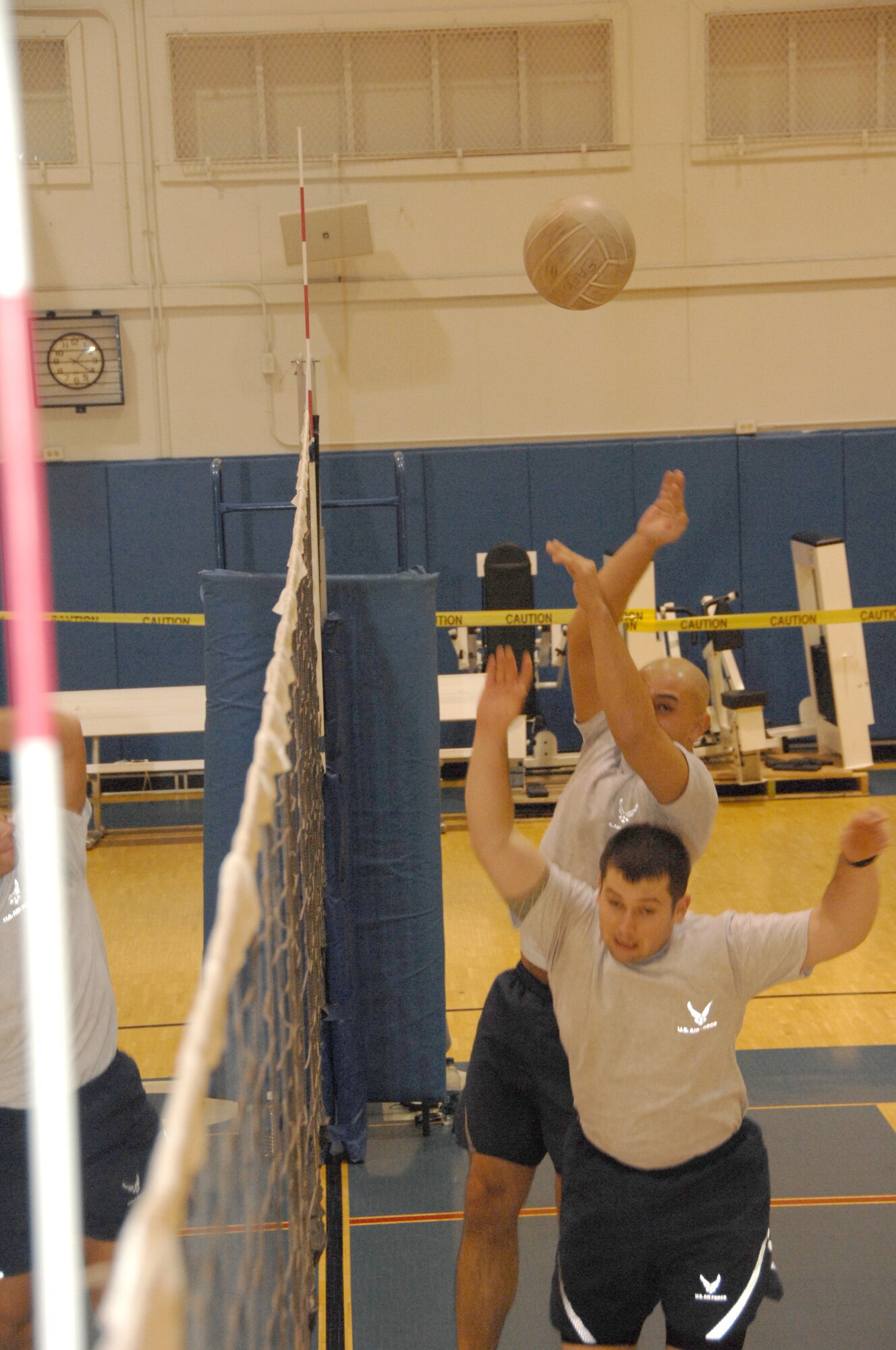 EIELSON AIR FORCE BASE, Alaska --  Two Airmen go for the volleyball at the same time causing a collision Oct. 18, 2007 at the fitness center. Airmen attending Airmen Leadership School participate in PT at least three days a week afterwards sharpening their skills in volley ball preparing for the Airmen vs. Chief's showdown.  (U.S. Air Force photo by Airman 1st Class Christopher Griffin)(Released)