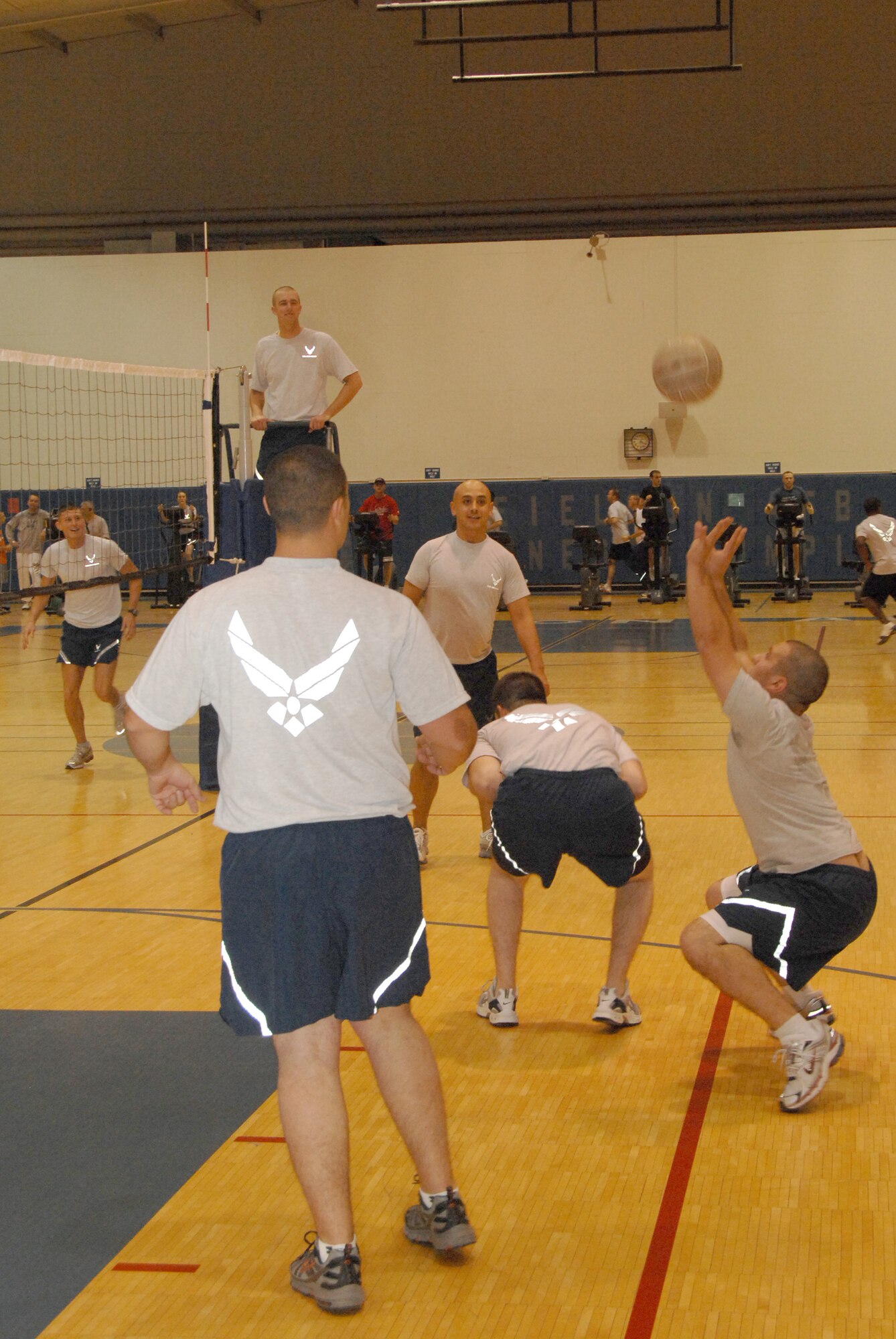 EIELSON AIR FORCE BASE, Alaska -- Senior Airman Gregory Gibbs, 354th Maintenance Squadron, sets a volleyball during group physical training Oct. 18. 2007 at the fitness center. Airman Gibbs is one of many students in his class attending Airman Leadership School, all Airmen in the class PT as a group atleast three days a week afterwards practicing their volleyball skills preparing for the Airmen vs. Chief showdown.  (U.S. Air Force photo by Airman 1st Class Christopher Griffin)(Released)