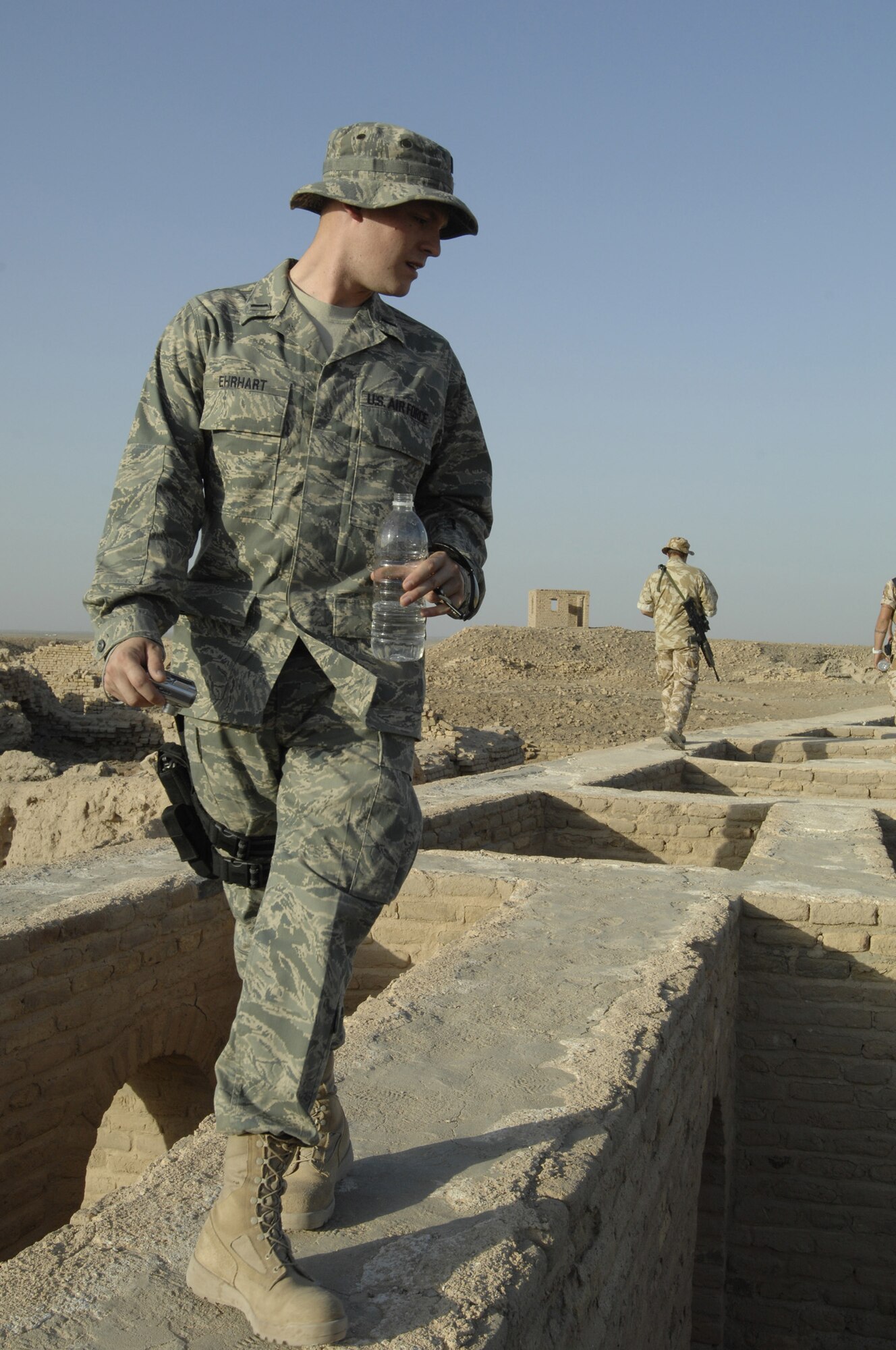 ALI AIR BASE, Iraq -- 1st Lt. Brian Ehrhart, 354th Maintenance Squadron, deployed to the 407th Expeditionary Logistic Readiness Squadron, walks on top of Abraham house in the ancient city of Ur Sept. 28 at Ali Air Base, Iraq. The 407th Expeditionary Services Squadron offers guided tours to help raise morale. The Ziggurat was built as a place to worship the moon god Nanna in the ancient city of Ur nearly 4,000 years ago. (U.S. Air Force photo by Airman 1st Class Jonathan Snyder) (Released)