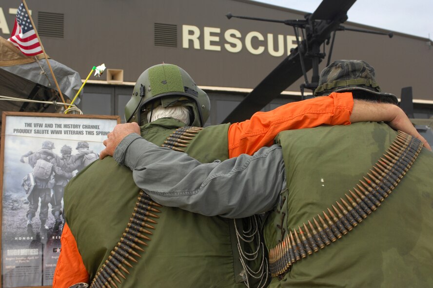 MOODY AIR FORCE BASE, Ga., -- Douglas Taylor and George McKee, members of Veterans of Foreign Wars Post 8433, pause in front of a display after watching an aerial demonstration during Team Moody AirFest Oct 21.  (U.S. Air Force photo by Senior Airman Angelita Lawrence)