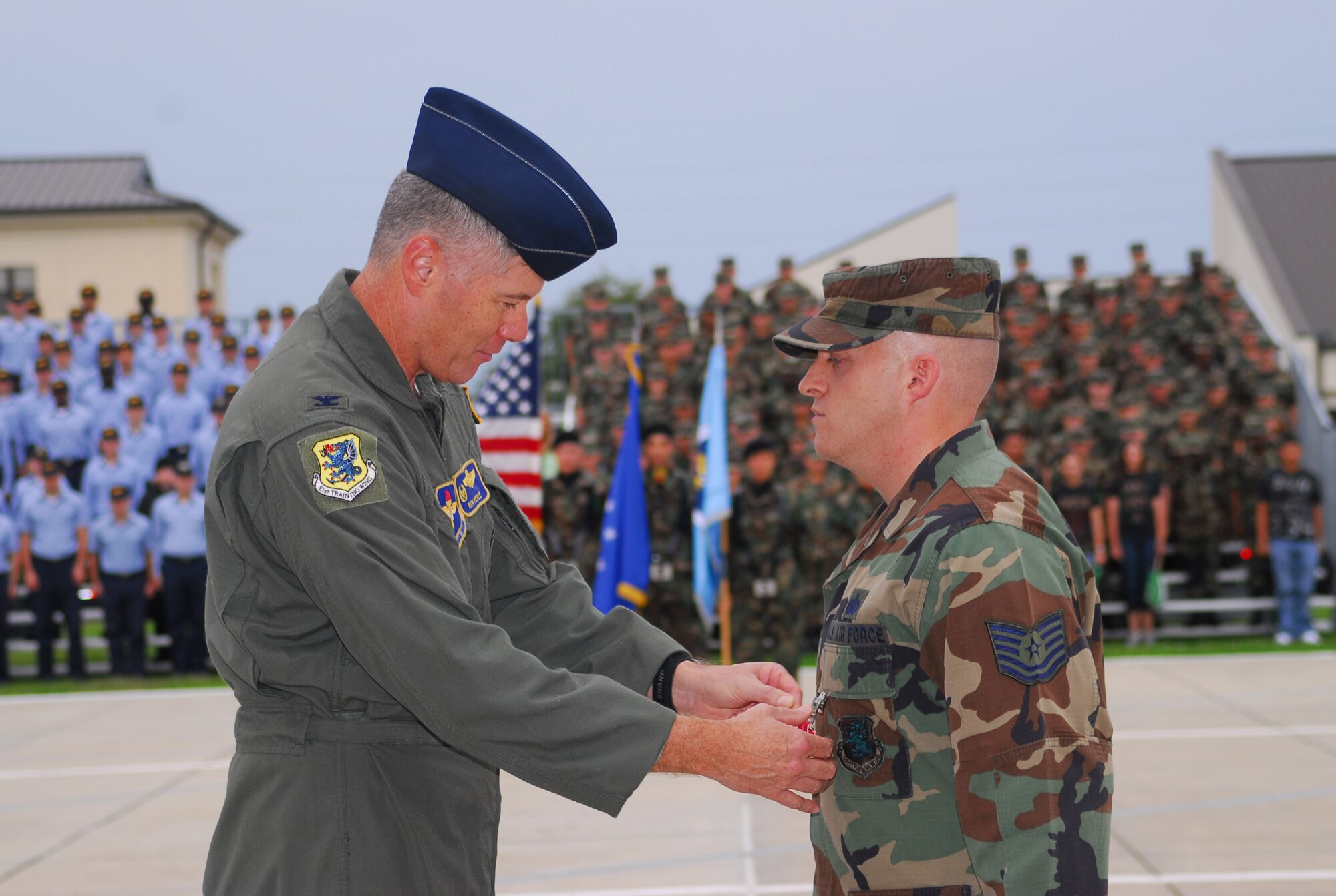 Tech. Sgt. Michael Soucy receives the Bronze Star for meritorious service while deployed to Iraq in support of the global war on terror.  Col. Richard Pierce, 81st Training Wing vice commander, presented the award to the 12-year veteran during a ceremony at Keesler Air Force Base, Miss., Friday, Oct. 19, 2007.  Sergeant Soucy serves as an intelligence analyst for the 81st Training Wing at Keesler.  (Courtesy photo)