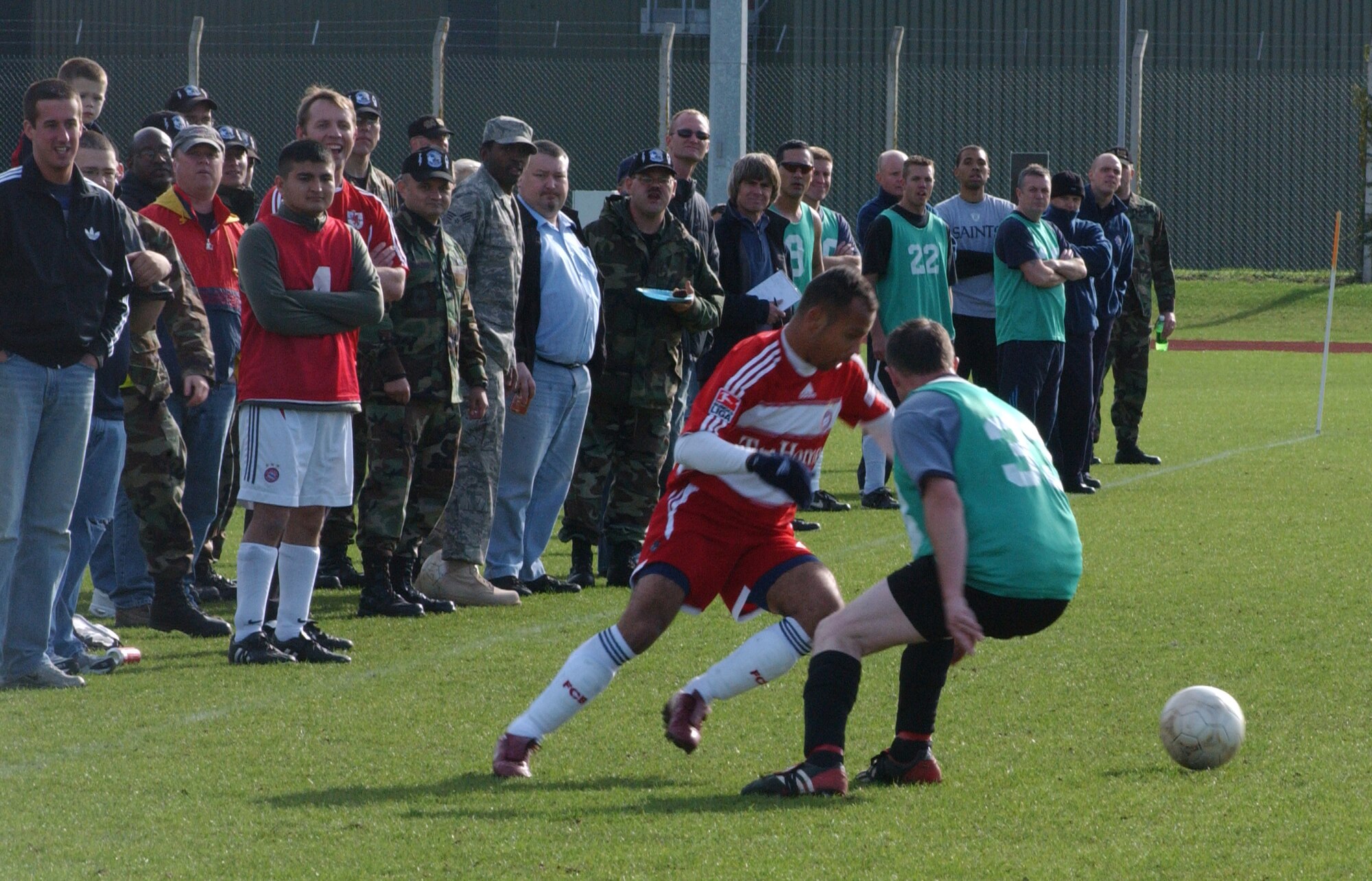 Mike Dedousis, the 727th coach, cuts inside Steve Duffin (33), the Fire Department captain, during the outdoor soccer championships held at the RAF Mildenhall sports field Oct. 18. (U. S. Air Force photo by Airman 1st Class Brad Smith)