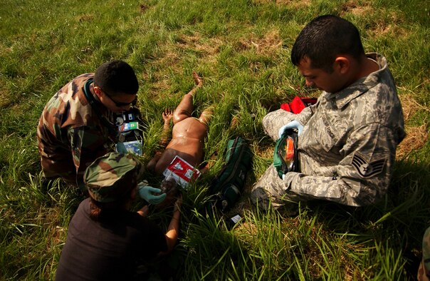 A simulated gas explosion brings base agencies together to administer first aid to the "victims" during the Local Operational Readiness Exercise here Oct. 22.  (U.S. Air Force photo/Tech. Sgt. Rey Ramon)

